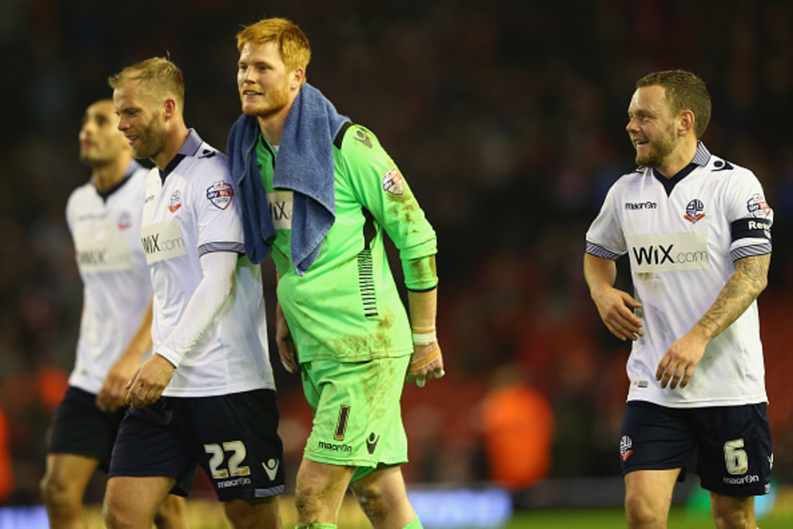 LIVERPOOL, ENGLAND - JANUARY 24: Eidur Gudjohnsen (L), Adam Bogdan (C) and Jay Spearing (R) of Bolton walk towards the travelling suppor to celebrate their sides draw on the final whistle during the FA Cup fourth round match between Liverpool and Bolton W