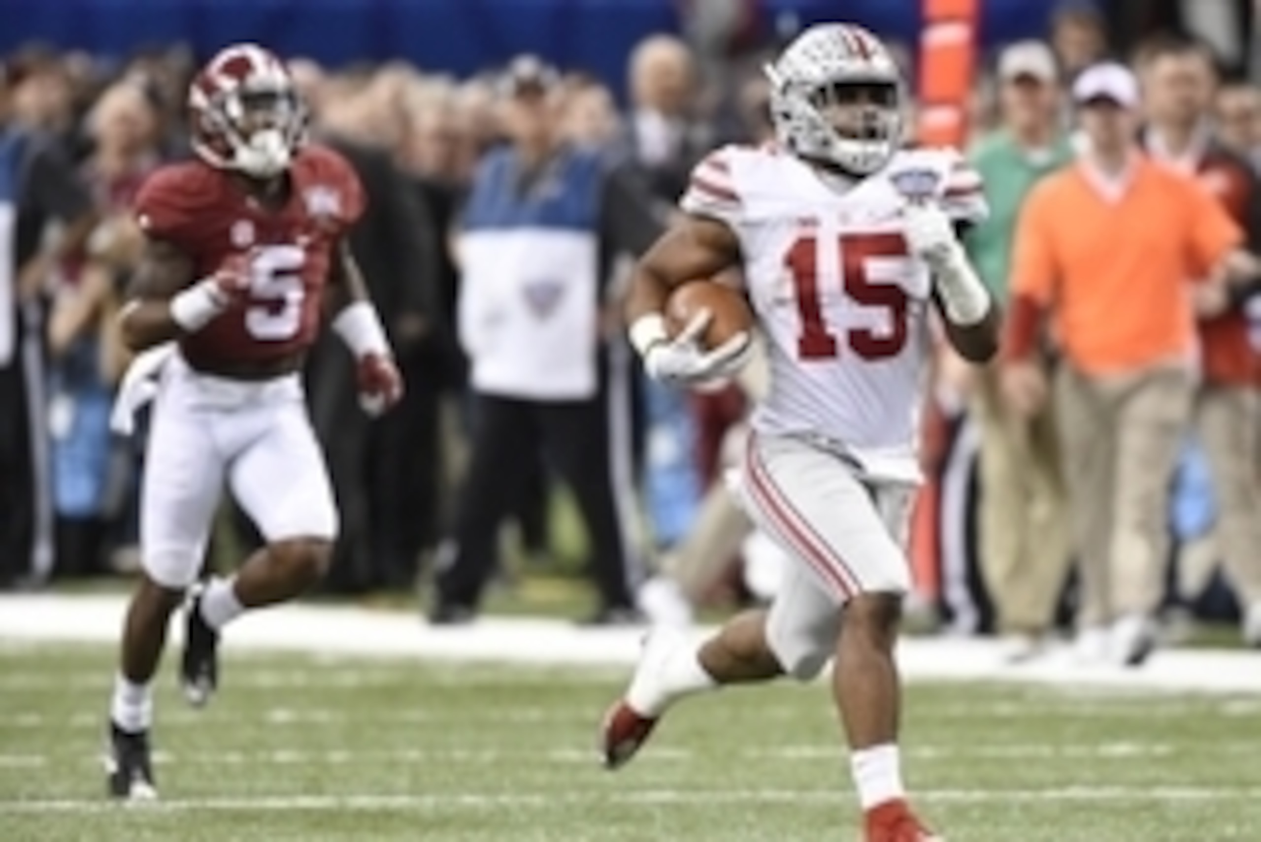 Jan 1, 2015; New Orleans, LA, USA; Ohio State Buckeyes running back Ezekiel Elliott (15) runs a touchdown past Alabama Crimson Tide defensive back Cyrus Jones (5) during the fourth quarter in the 2015 Sugar Bowl at Mercedes-Benz Superdome. Mandatory Credi