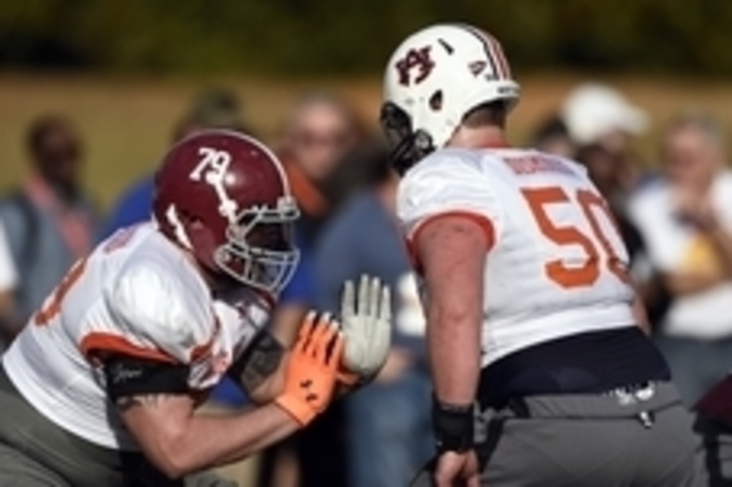 Jan 20, 2015; Fairhope, AL, USA; South squad offensive tackle Austin Shepherd of Alabama (79) and South squad offensive center Reese Dismukes of Auburn (50) run blocking drills during practice at Fairhope Stadium. Mandatory Credit: John David Mercer-USA T