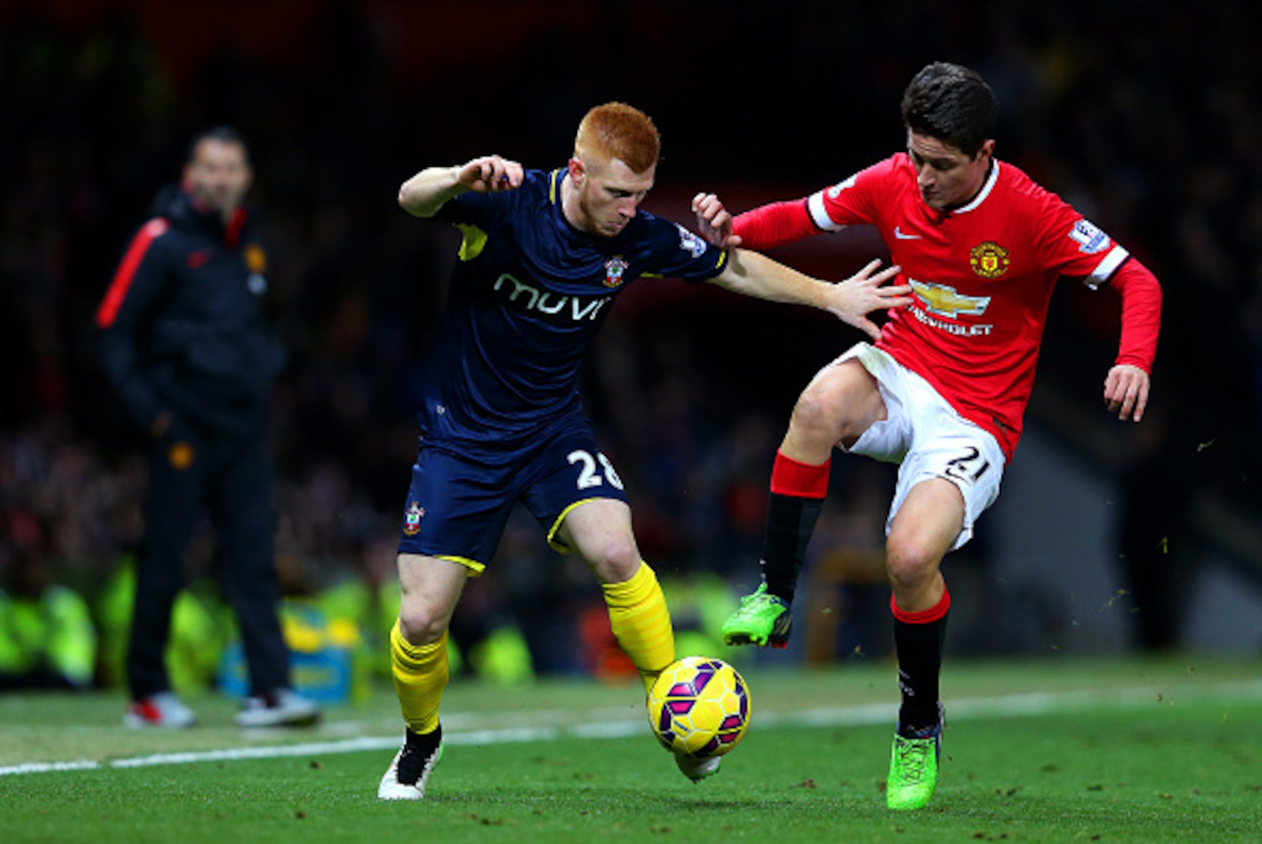 MANCHESTER, ENGLAND - JANUARY 11:  Ander Herrera of Manchester United battles for the ball with Harrison Reed of Southampton during the Barclays Premier League match between Manchester United and Southampton at Old Trafford on January 11, 2015 in Manchest
