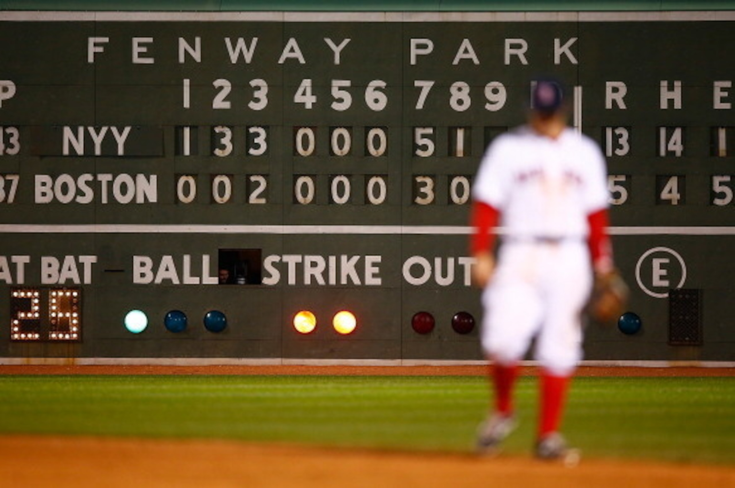 BOSTON, MA - APRIL 24: The scoreboard under the Green Monster shows a score of 13-4 in the 9th inning between the Boston Red Sox and the New York Yankees during the game at Fenway Park on April 24, 2014 in Boston, Massachusetts.  (Photo by Jared Wickerham