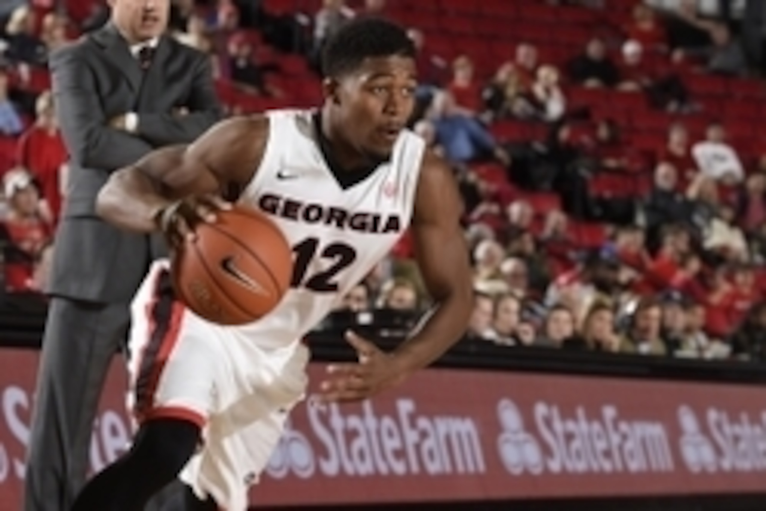 Nov 21, 2014; Athens, GA, USA; Georgia Bulldogs guard Kenny Gaines (12) drives the ball to the basket against the Troy Trojans at Stegeman Coliseum. Georgia defeated Troy 82-60. Mandatory Credit: Dale Zanine-USA TODAY Sports