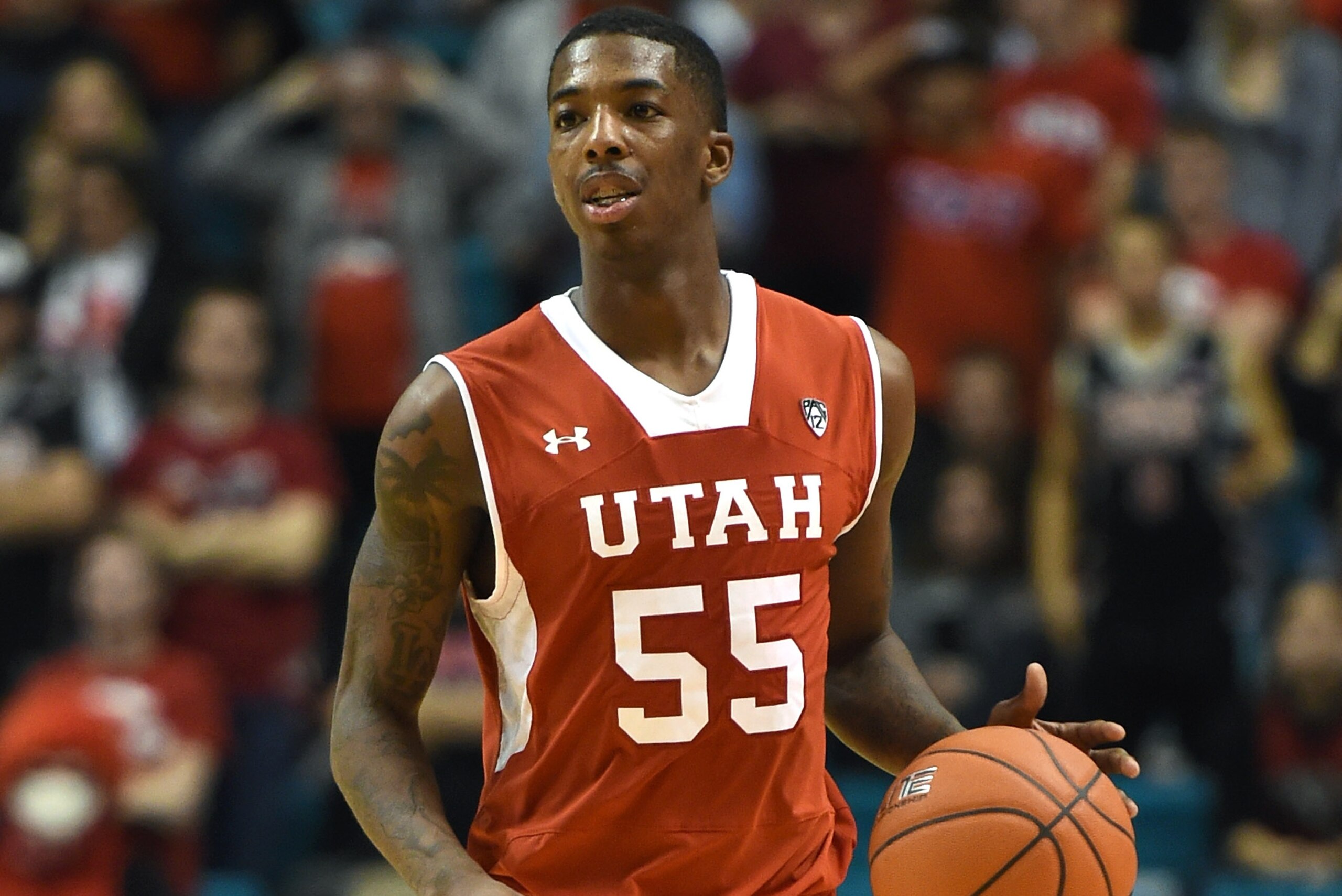 LAS VEGAS, NV - DECEMBER 20:  Delon Wright #55 of the Utah Utes brings the ball up the court against the UNLV Rebels during the 2014 MGM Grand Showcase basketball event at the MGM Grand Garden Arena on December 20, 2014 in Las Vegas, Nevada. Utah won 59-4