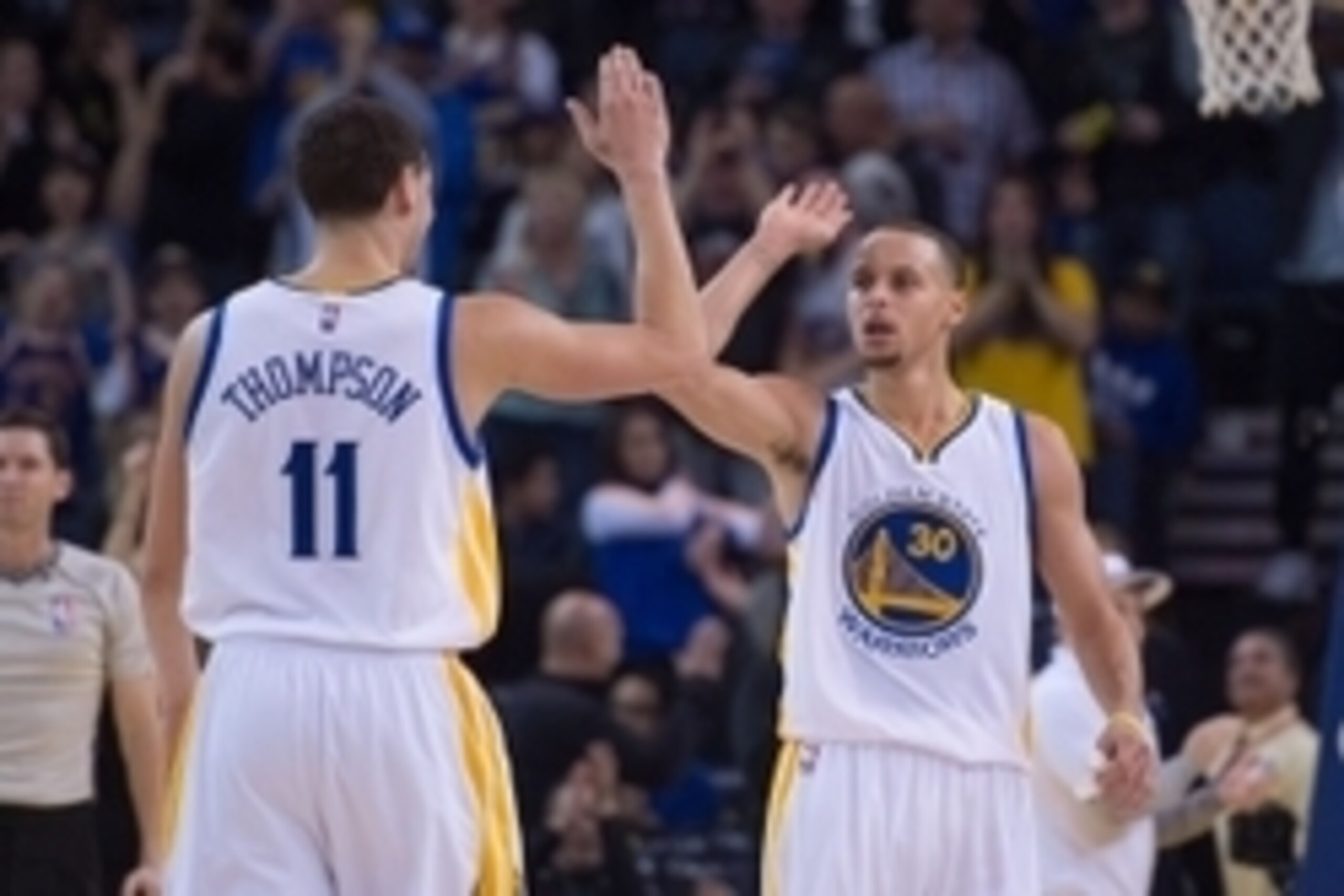 January 2, 2015; Oakland, CA, USA; Golden State Warriors guard Stephen Curry (30) celebrates with guard Klay Thompson (11) against the Toronto Raptors during the fourth quarter at Oracle Arena. The Warriors defeated the Raptors 126-105. Mandatory Credit: 