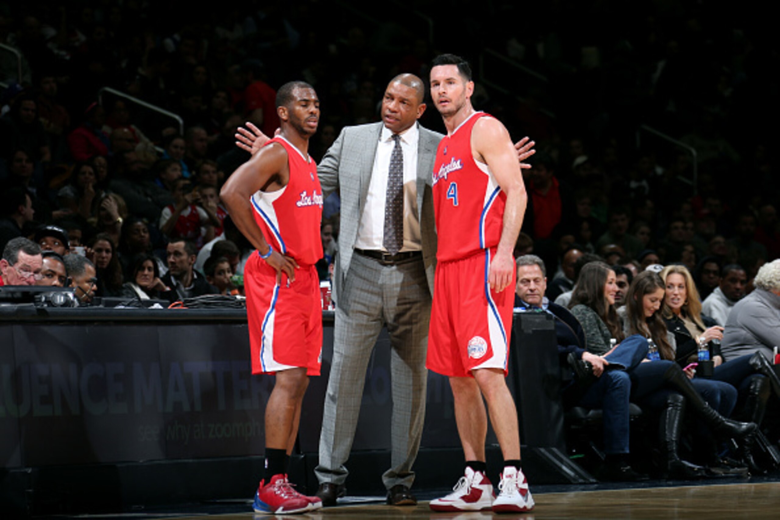 WASHINGTON, DC - DECEMBER 12: Chris Paul #3, J.J. Redick #4, and Doc Rivers of the Los Angeles Clippers speak during a game against hte Washington Wizards  at the Verizon Center on December 12, 2014 in Washington, DC. NOTE TO USER: User expressly acknowle