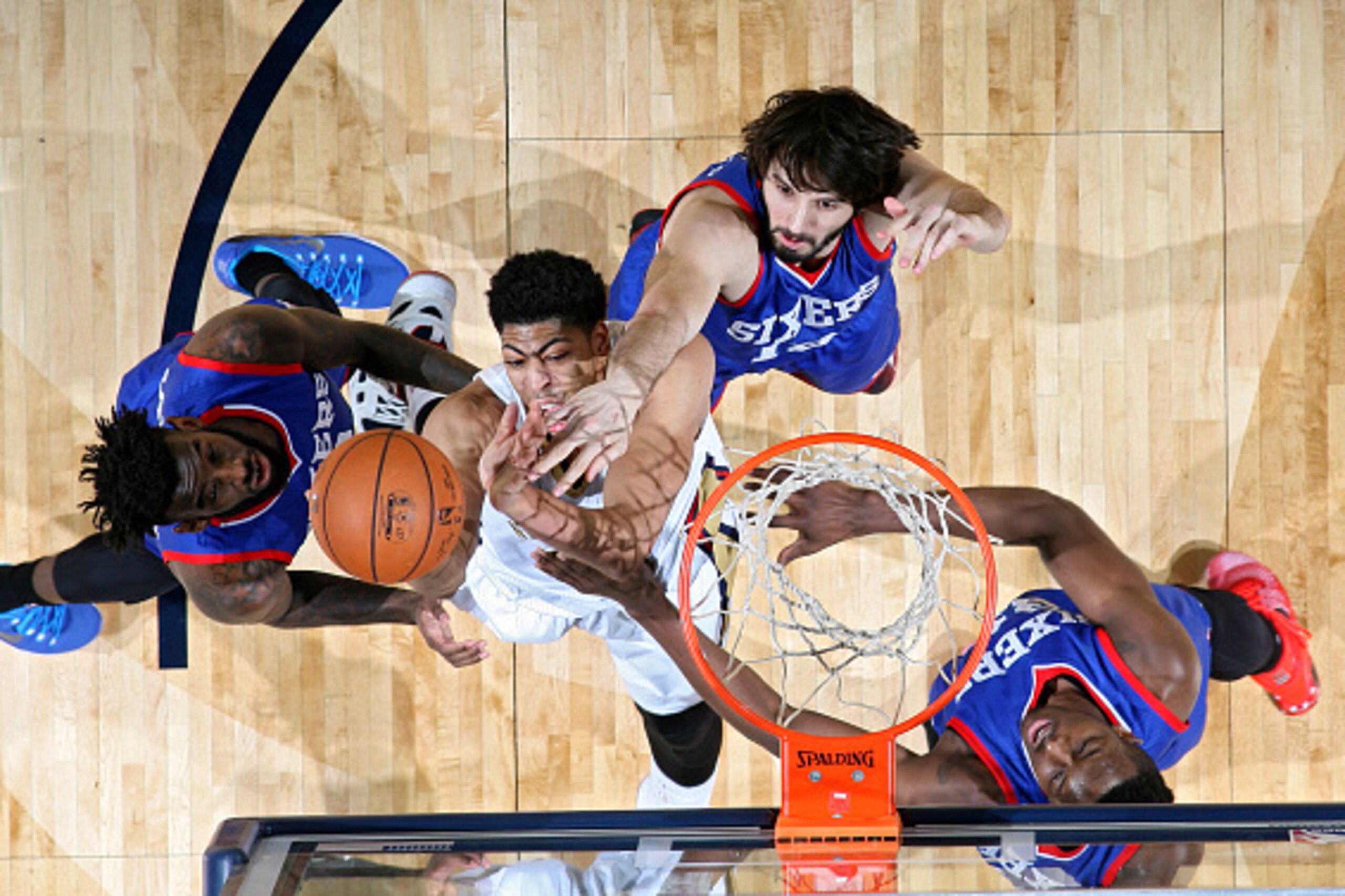 NEW ORLEANS, LA -  JANUARY 26: Anthony Davis #23 of the New Orleans Pelicans grabs a rebound against the Philadelphia 76ers on January 26, 2015 at Smoothie King Center in New Orleans, Louisiana. NOTE TO USER: User expressly acknowledges and agrees that, b
