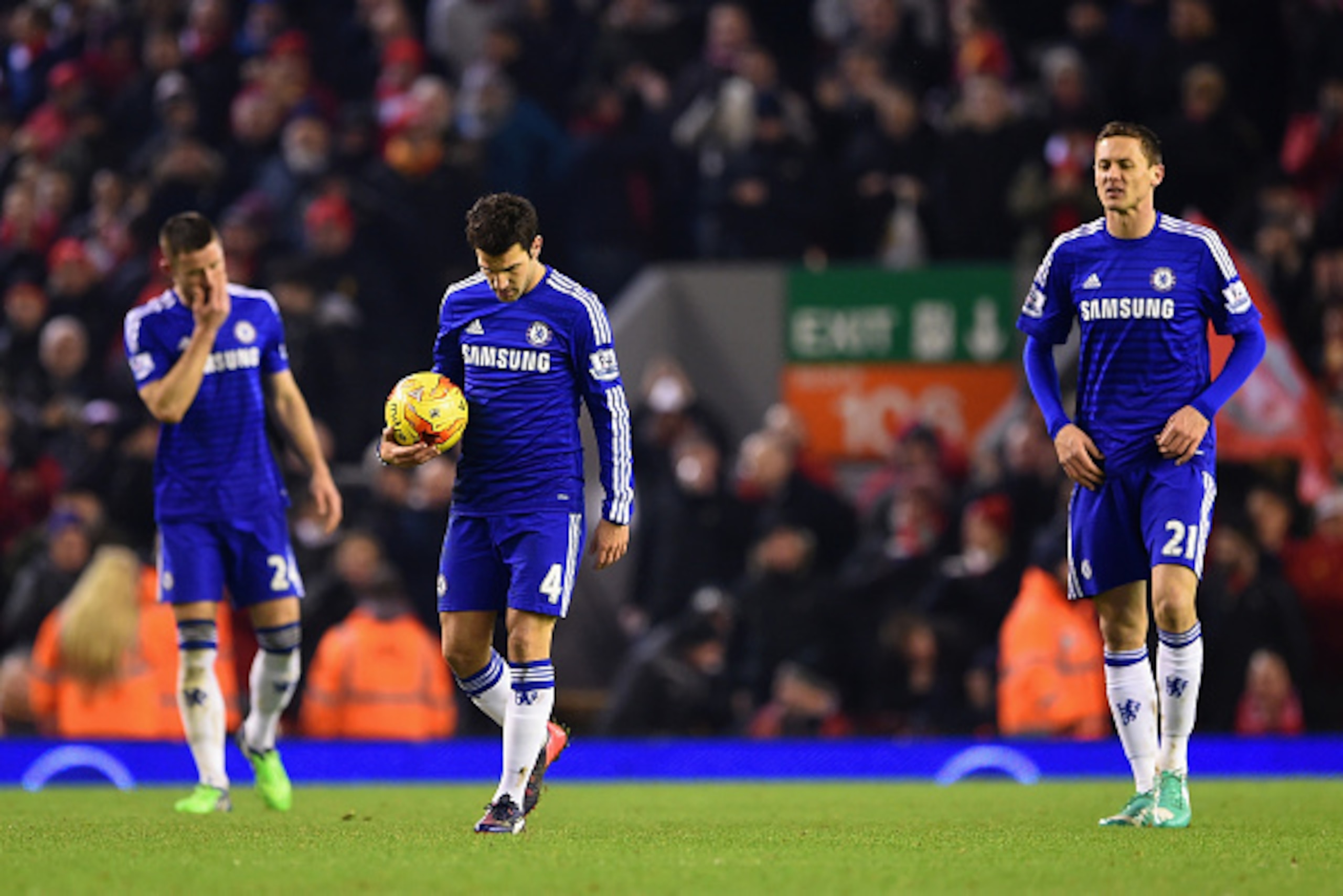 LIVERPOOL, ENGLAND - JANUARY 20:  A dejected Cesc Fabregas of Chelsea takes the matchball to restart after Raheem Sterling of Liverpool scored their first goal during the Capital One Cup Semi-Final first leg match between Liverpool and Chelsea at Anfield 