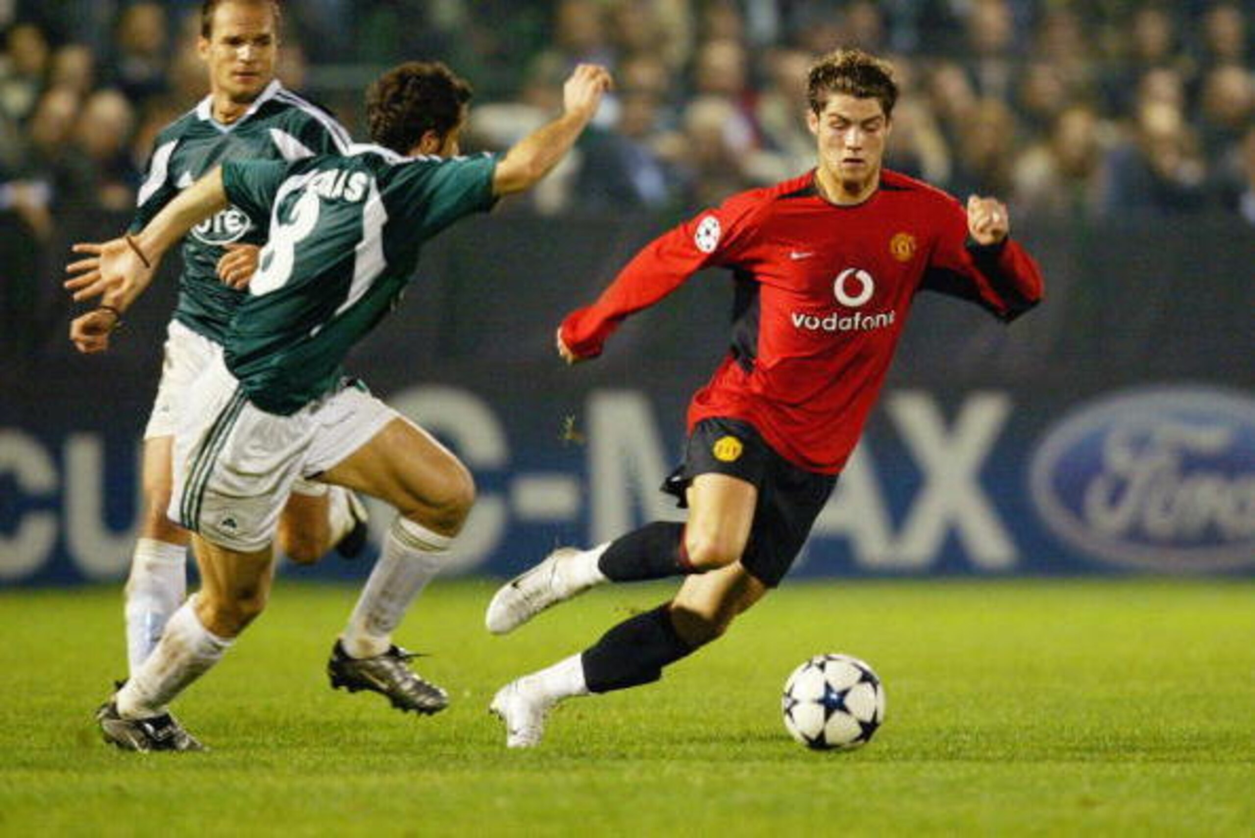 ATHENS - NOVEMBER 26:  Ioannis Goumas of Panathinaikos chases Cristiano Ronaldo of Manchester United during the UEFA Champions League Group E match between Panathinaikos and Manchester United on November 26, 2003 at Apostolos Nikolaidos Stadium in Athens,