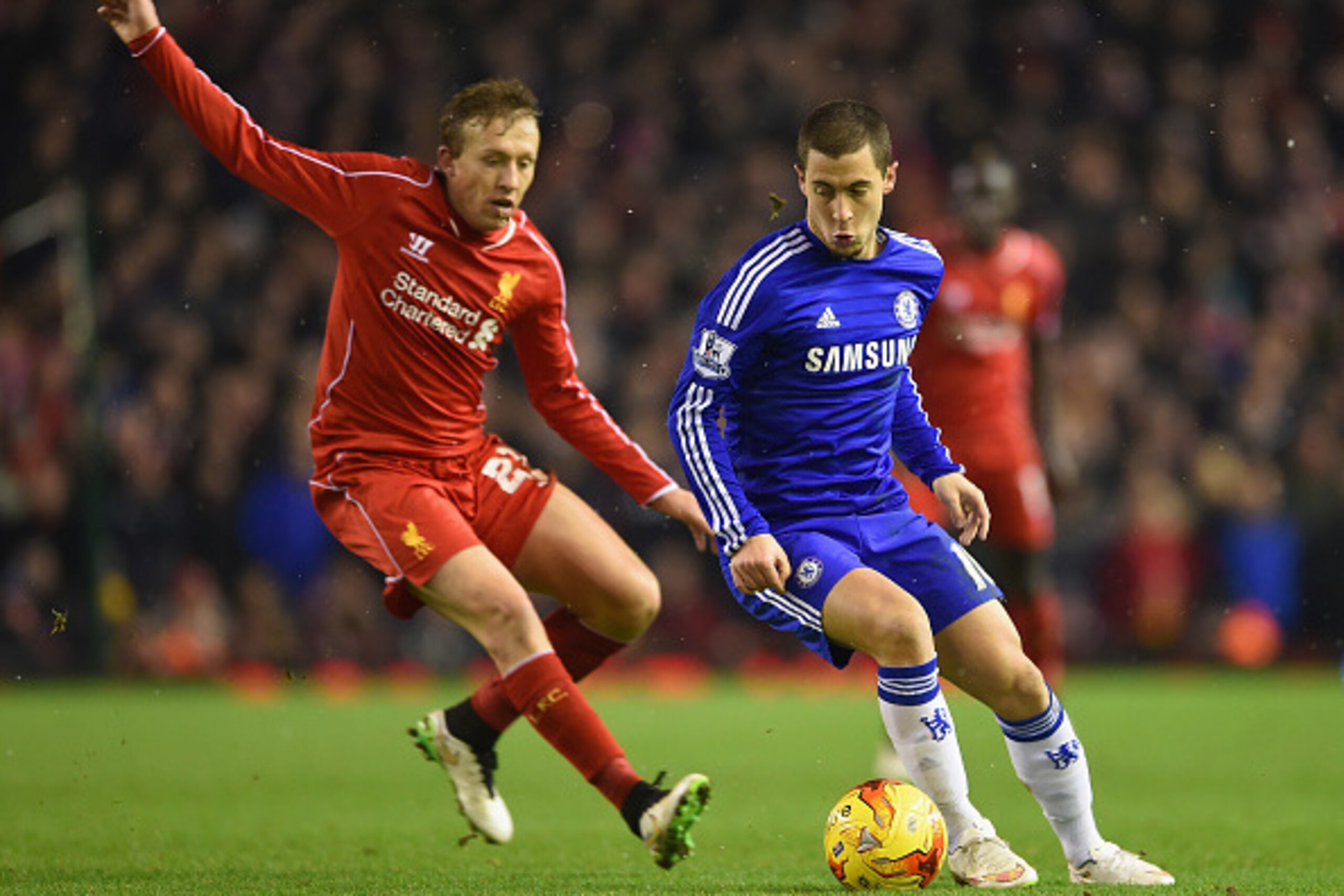 LIVERPOOL, ENGLAND - JANUARY 20: Eden Hazard of Chelsea is marshalled by Lucas Leiva of Liverpool  during the Capital One Cup Semi-Final first leg match between Liverpool and Chelsea at Anfield on January 20, 2015 in Liverpool, England.  (Photo by Michael