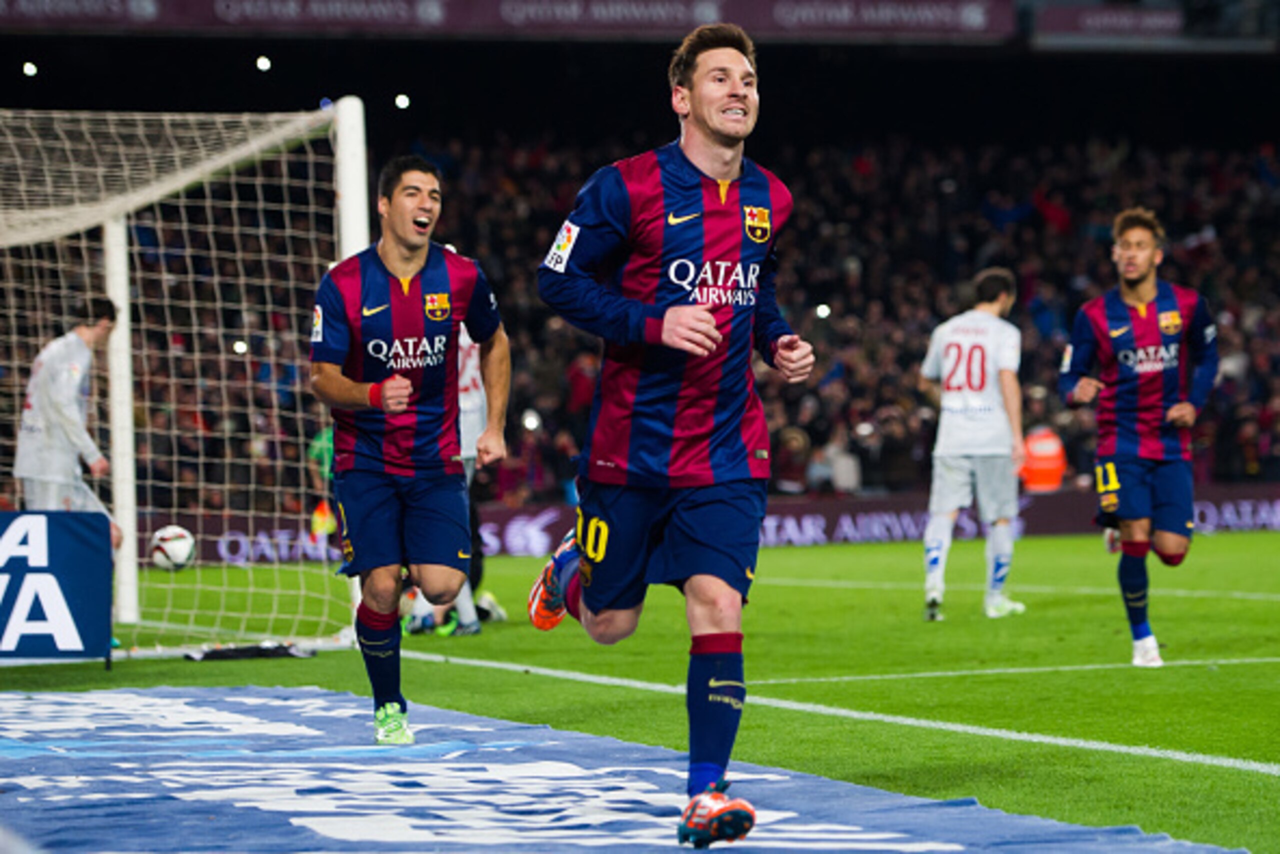 BARCELONA, SPAIN - JANUARY 21:  Lionel Messi of FC Barcelona celebrates after scoring his team's first goal during the Copa del Rey Quarter-Final First Leg match between FC Barcelona and Club Atletico de Madrid at Camp Nou on January 21, 2015 in Barcelona