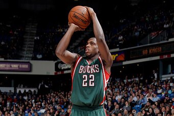 SACRAMENTO, CA - DECEMBER 18: Khris Middleton #22 of the Milwaukee Bucks shoots against the Sacramento Kings on December 18, 2014 at Sleep Train Arena in Sacramento, California. NOTE TO USER: User expressly acknowledges and agrees that, by downloading and