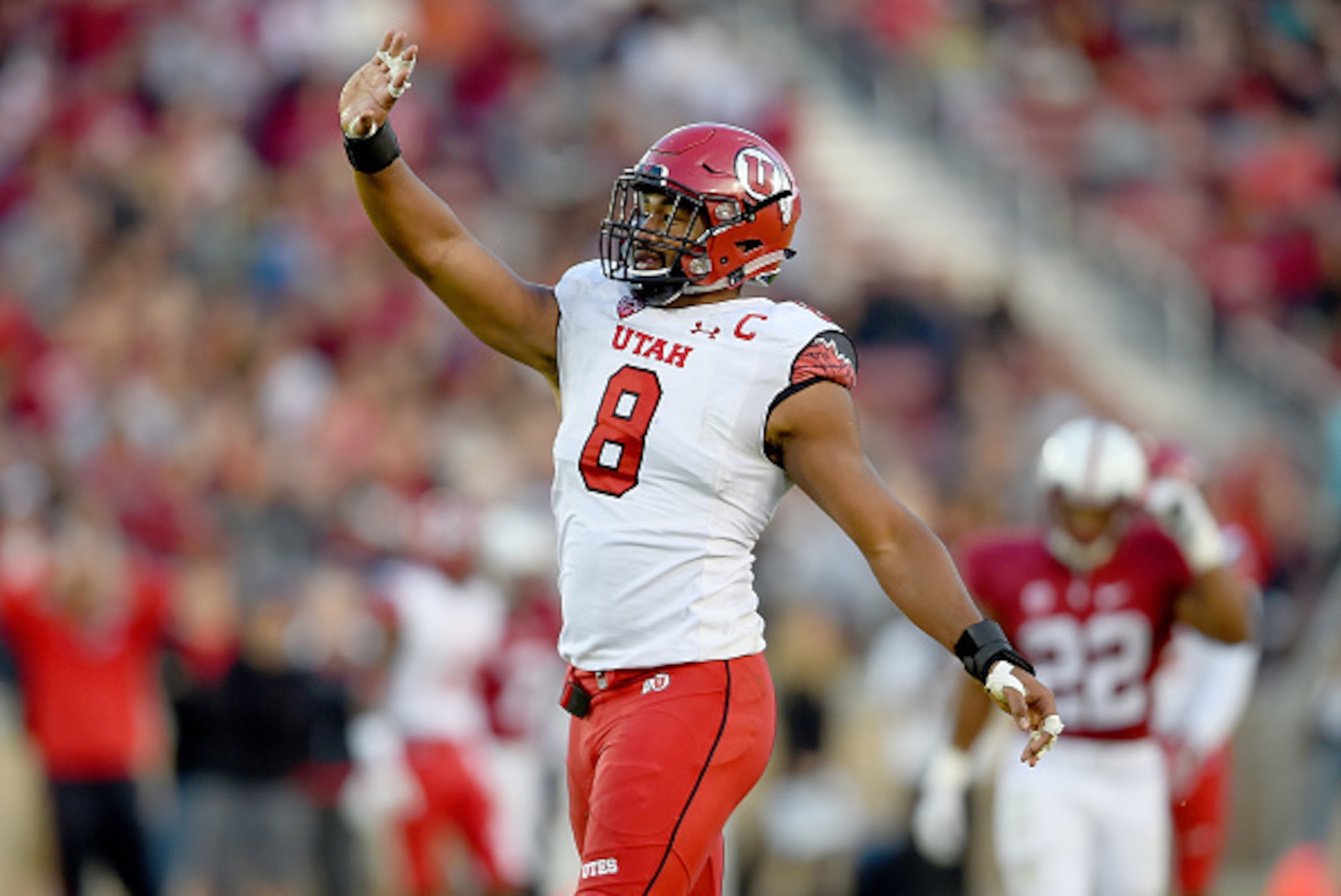PALO ALTO, CA - NOVEMBER 15:  Nate Orchard #8 of the Utah Utes celebrates after sacking quarterback Kevin Hogan #8 of the Stanford Cardinal in the second quarter at Stanford Stadium on November 15, 2014 in Palo Alto, California.  (Photo by Thearon W. Hend