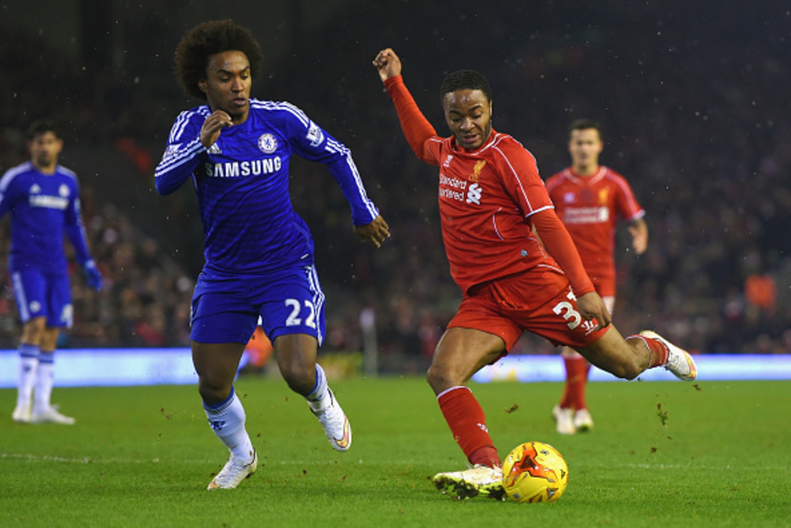 LIVERPOOL, ENGLAND - JANUARY 20:  Willian of Chelsea closes down Raheem Sterling of Liverpool during the Capital One Cup Semi-Final first leg match between Liverpool and Chelsea at Anfield on January 20, 2015 in Liverpool, England.  (Photo by Michael Rega