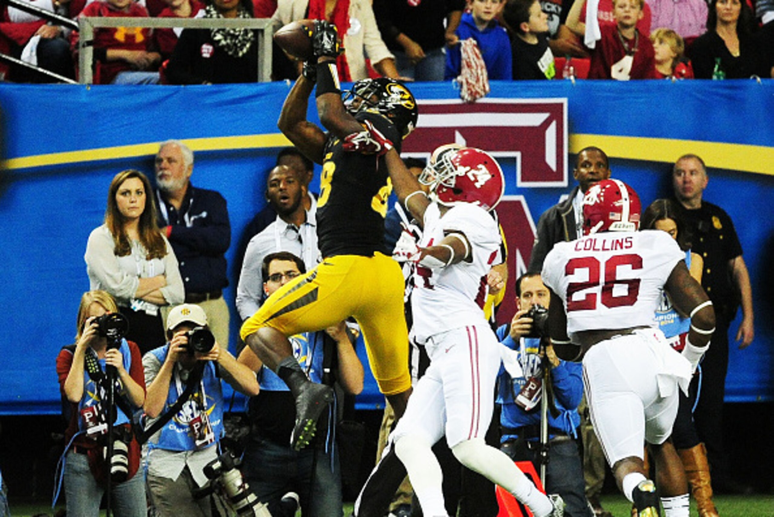 ATLANTA, GA - DECEMBER 06:  Jimmie Hunt #88 of the Missouri Tigers completes a reception against the defense of Geno Smith #24 of the Alabama Crimson Tide in the second quarter of the SEC Championship game at the Georgia Dome on December 6, 2014 in Atlant