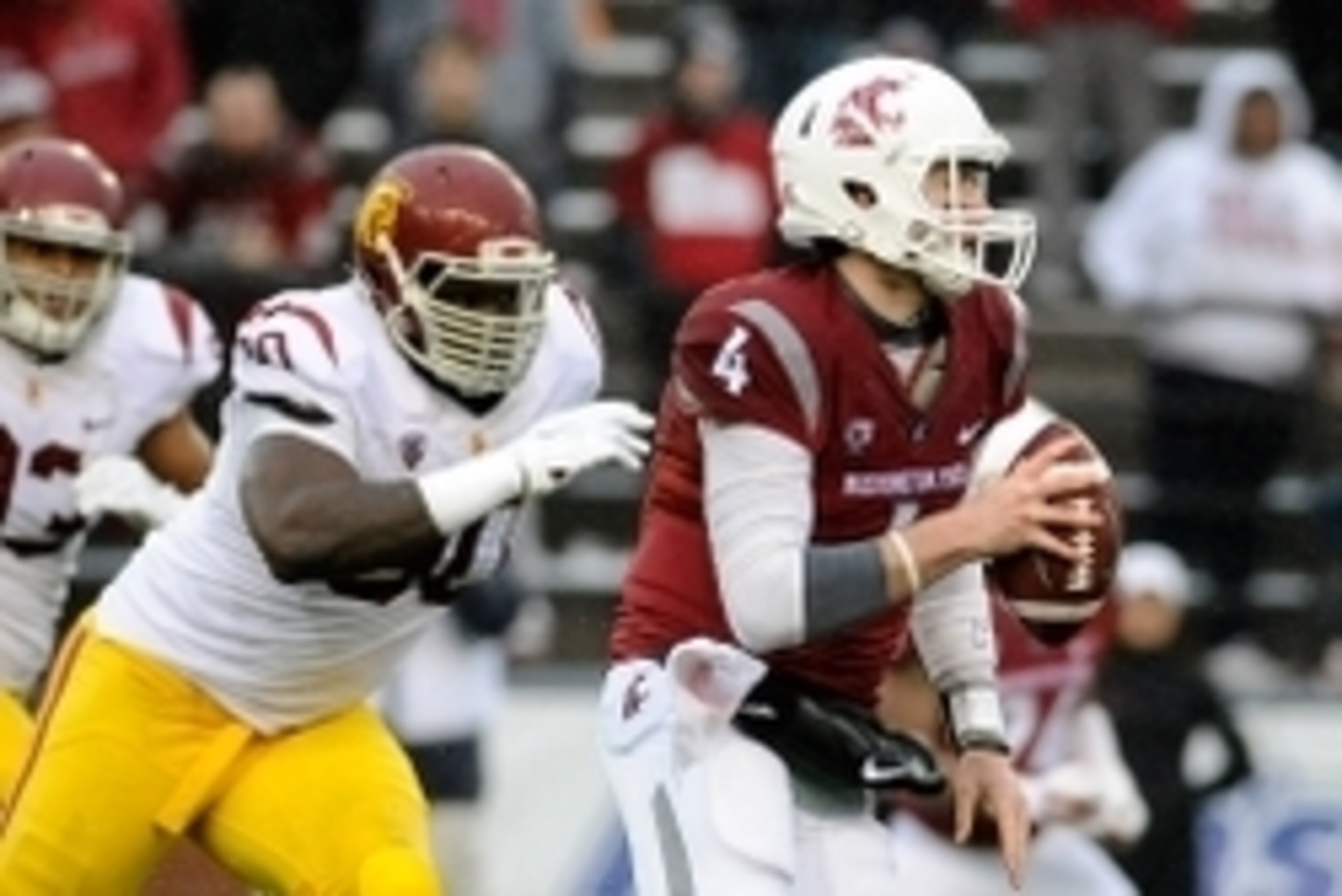 Nov 1, 2014; Pullman, WA, USA; Washington State Cougars quarterback Luke Falk (4) gets by Southern California Trojans defensive tackle Claude Pelon (90) during the second half at Martin Stadium. The Trojans won 44-17. Mandatory Credit: James Snook-USA TOD Nov 1, 2014; Pullman, WA, USA; Washington State Cougars quarterback Luke Falk (4) gets by Southern California Trojans defensive tackle Claude Pelon (90) during the second half at Martin Stadium. The Trojans won 44-17. Mandatory Credit: James Snook-USA TOD