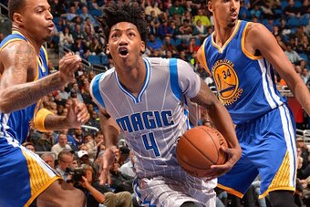 ORLANDO, FL - NOVEMBER 26:  Elfrid Payton #4 of the Orlando Magic handles the ball against the Golden State Warriors during the game on November 26, 2014 at Amway Center in Orlando, Florida. NOTE TO USER: User expressly acknowledges and agrees that, by do