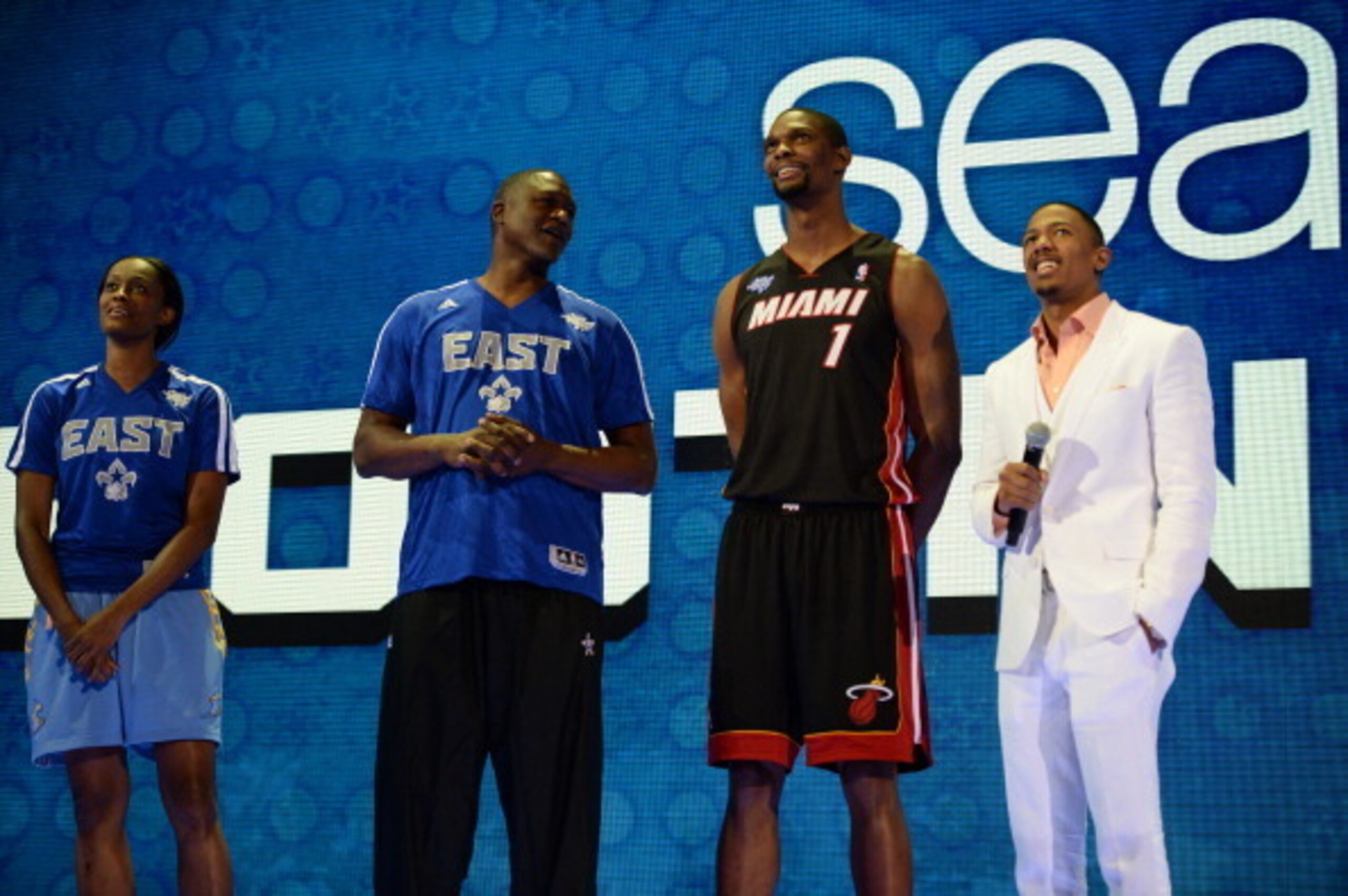 NEW ORLEANS, LA - FEBRUARY 15: Swin Cash #8, Dominique Wilkins #21, and Chris Bosh #1 of the East Team stand with television personality Nick Cannon during the Sears Shooting Stars Competition on State Farm All-Star Saturday Night as part of the 2014 All-