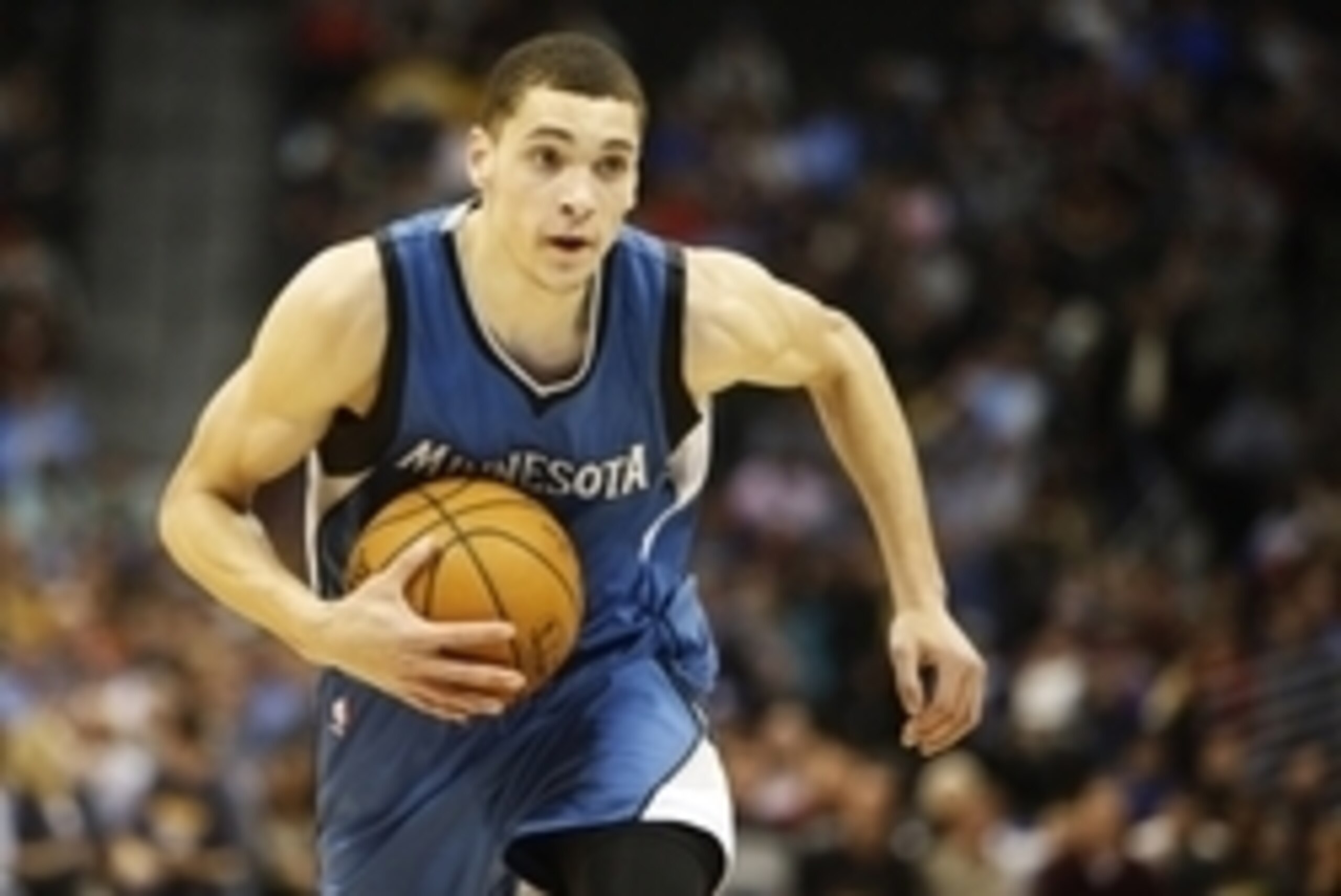 Dec 26, 2014; Denver, CO, USA; Minnesota Timberwolves guard Zach LaVine (8) runs the ball down the court during the second half against the Denver Nuggets at Pepsi Center.  The Nuggets won 106-102.  Mandatory Credit: Chris Humphreys-USA TODAY Sports