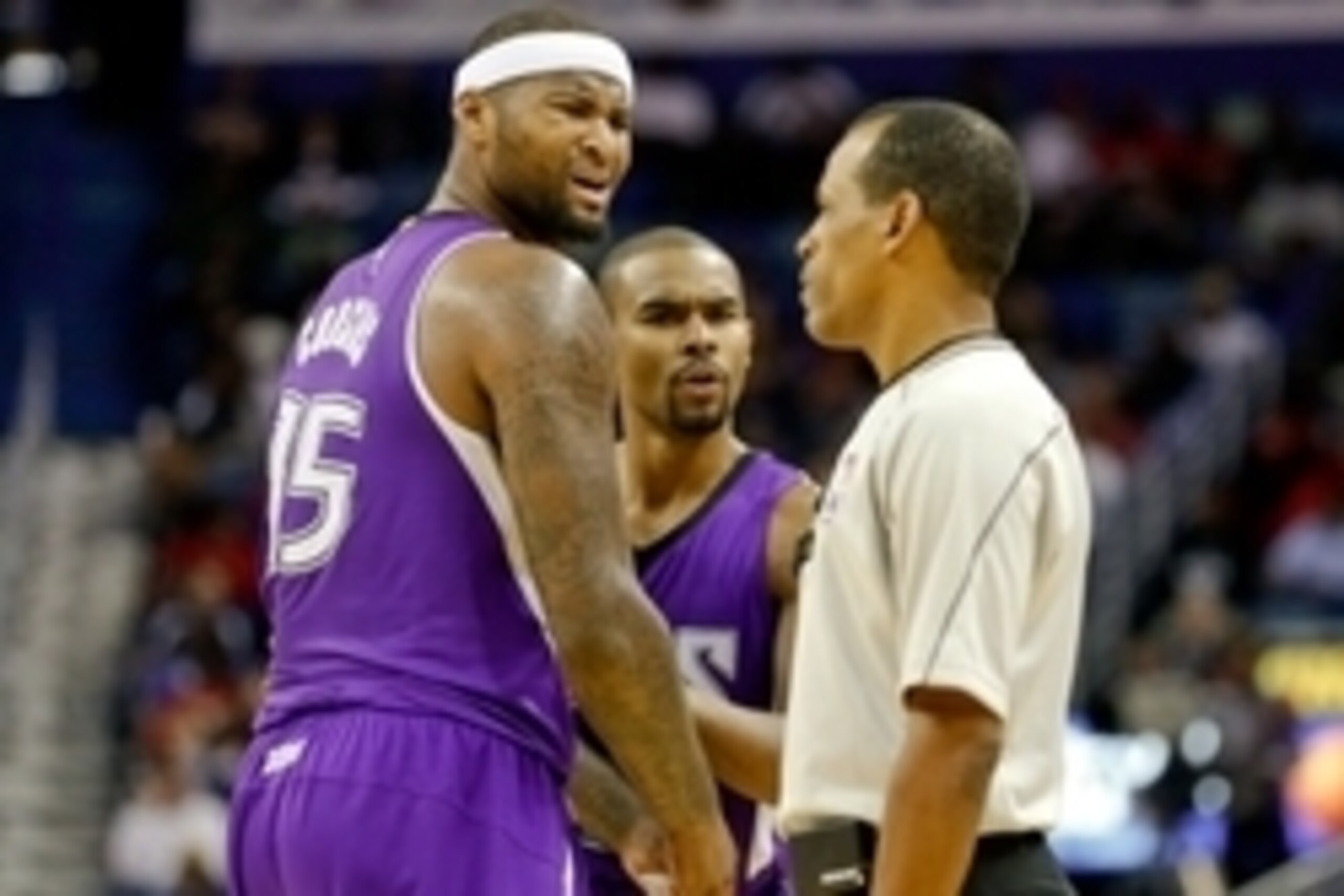 Nov 25, 2014; New Orleans, LA, USA; Sacramento Kings center DeMarcus Cousins (15) argues with referee Eric Lewis (42) after head coach Michael Malone (not pictured) was ejected from the game during the second quarter of a game against the New Orleans Peli