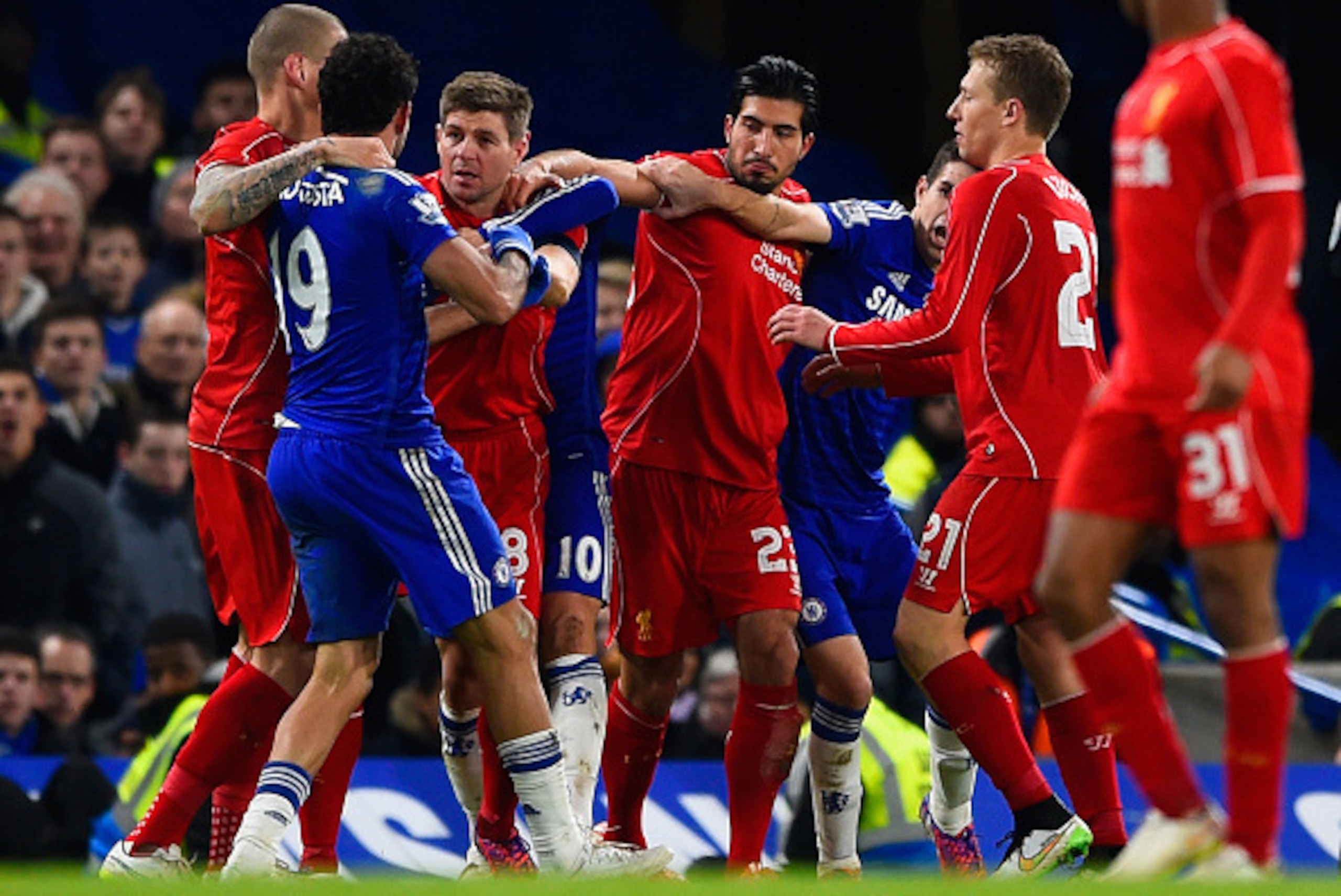 LONDON, ENGLAND - JANUARY 27:  Diego Costa of Chelsea clashes with Steven Gerrard and Emre Can of Liverpool during the Capital One Cup Semi-Final second leg between Chelsea and Liverpool at Stamford Bridge on January 27, 2015 in London, England.  (Photo b