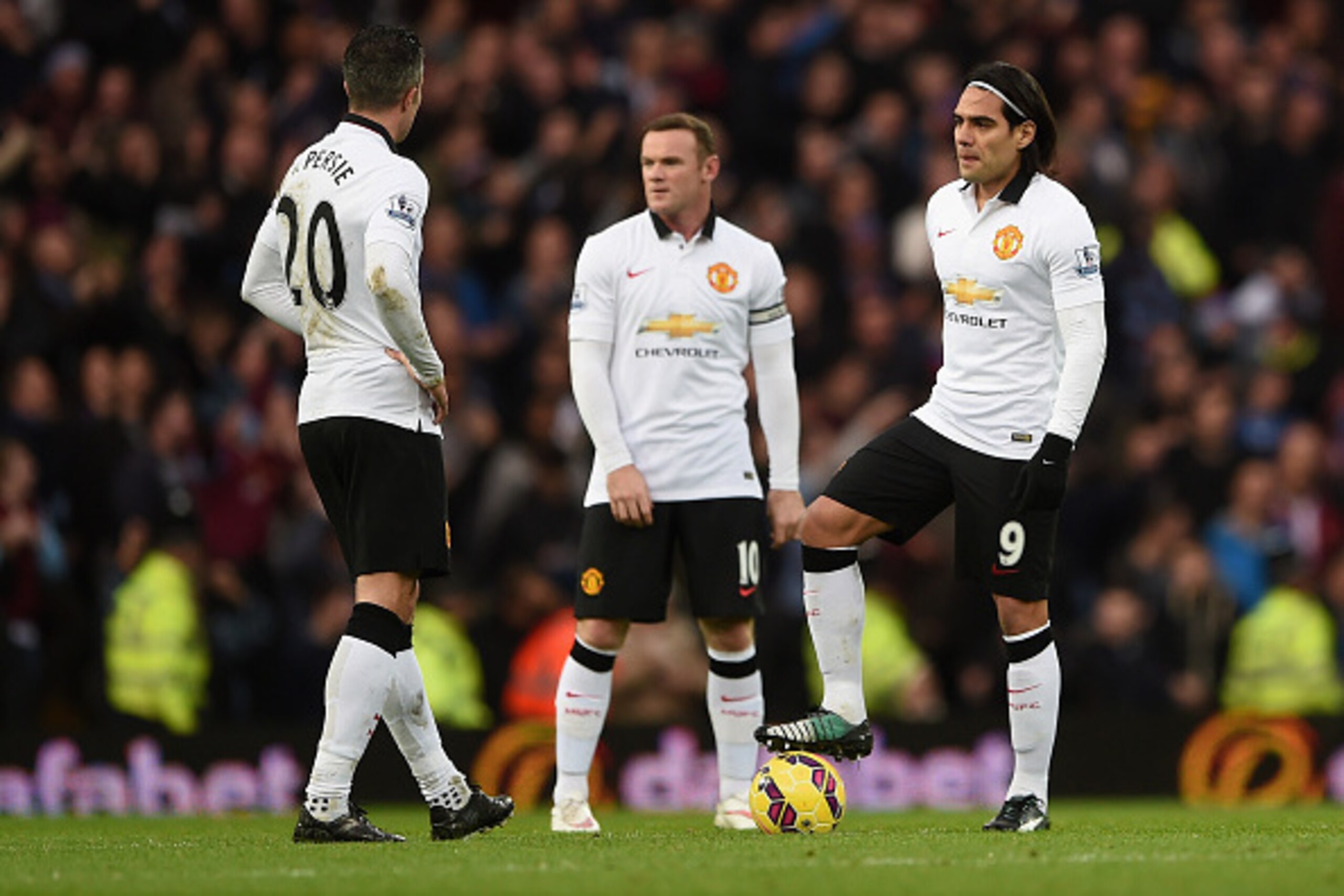 BIRMINGHAM, ENGLAND - DECEMBER 20:  A dejected Robin van Persie, Wayne Rooney and Radamel Falcao García of Manchester United prepare to restart after conceding the first goal during the Barclays Premier League match between Aston Villa and Manchester Unit
