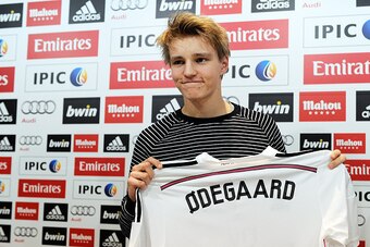 MADRID, SPAIN - JANUARY 22:  Martin Odegaard from Norway holds his new Real Madrid shirt during a press conference at Real Madrid's Valdebebas training grounds after he signed with Real on January 22, 2015 in Madrid, Spain. Odegaard aged 16 will play for 