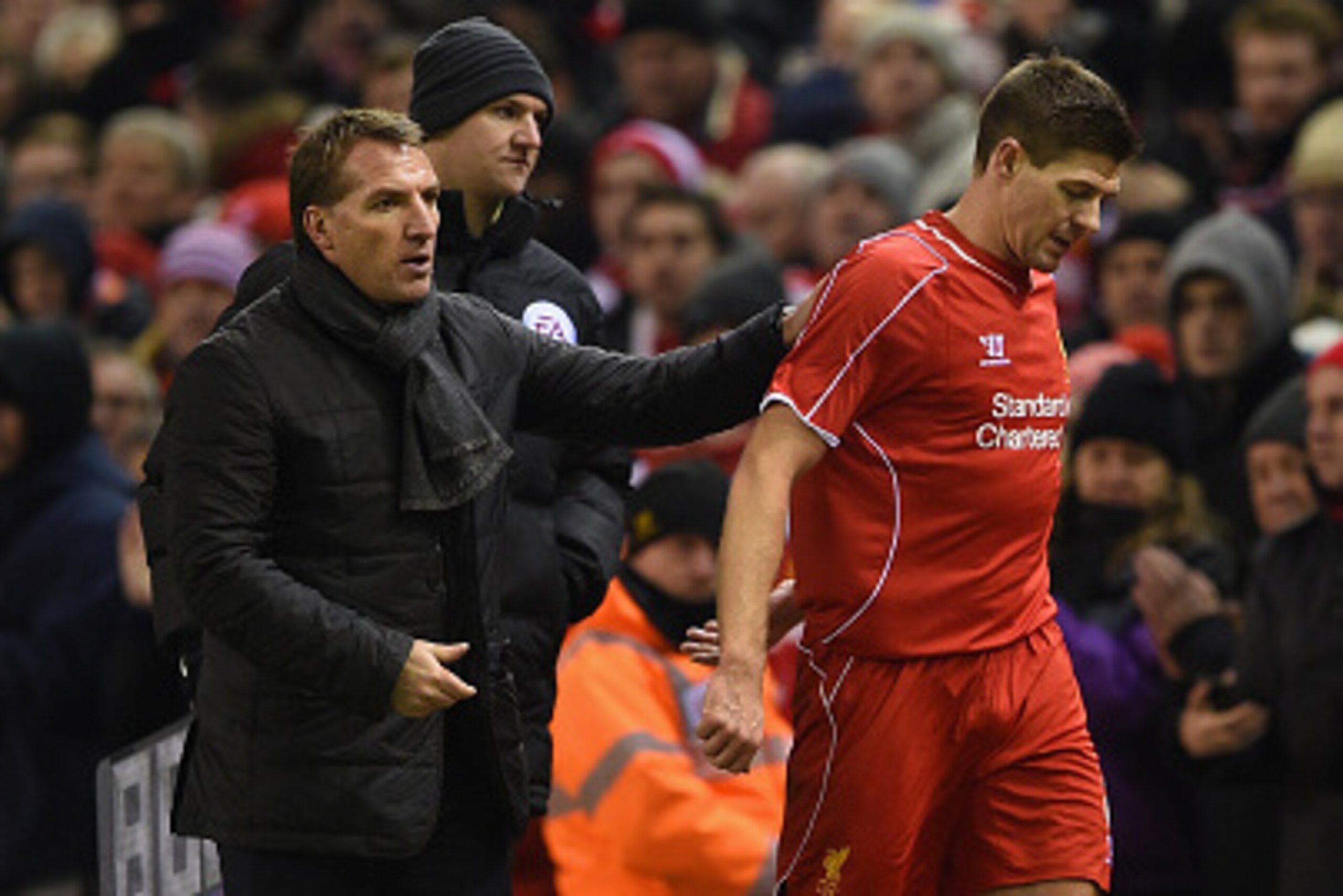 LIVERPOOL, ENGLAND - JANUARY 20:  Brendan Rodgers, manager of Liverpool pats Steven Gerrard of Liverpool on the back as he is subsituted during the Capital One Cup Semi-Final first leg match between Liverpool and Chelsea at Anfield on January 20, 2015 in 