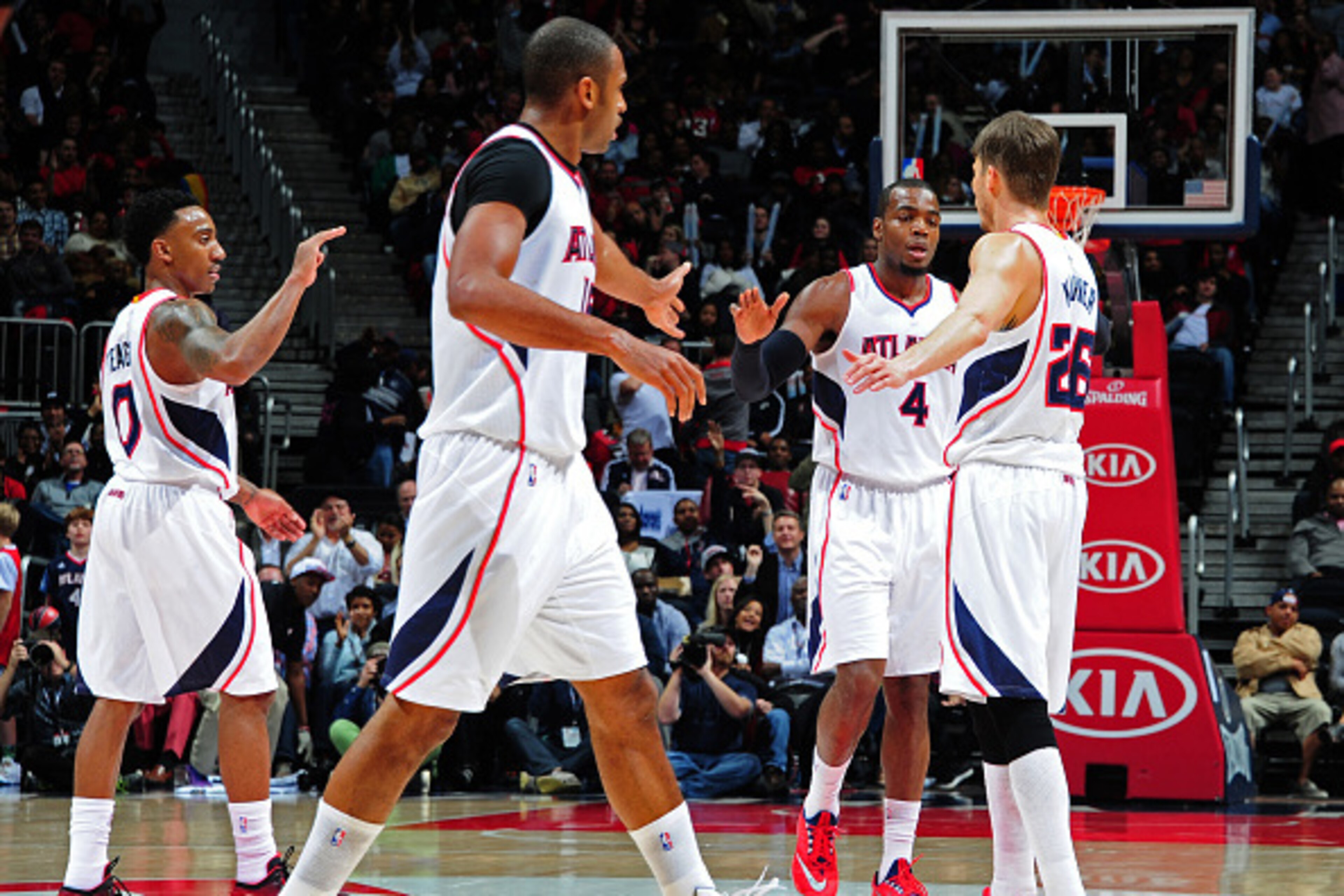 ATLANTA, GA - JANUARY 21:Jeff Teague #0, Al Horford #15, Paul Millsap #4, and Kyle Korver #26 of the Atlanta Hawks celebrate after a score against the Indiana Pacers on January 21, 2015 at Philips Arena in Atlanta, Georgia. NOTE TO USER: User expressly a ATLANTA, GA - JANUARY 21:Jeff Teague #0, Al Horford #15, Paul Millsap #4, and Kyle Korver #26 of the Atlanta Hawks celebrate after a score against the Indiana Pacers on January 21, 2015 at Philips Arena in Atlanta, Georgia. NOTE TO USER: User expressly a