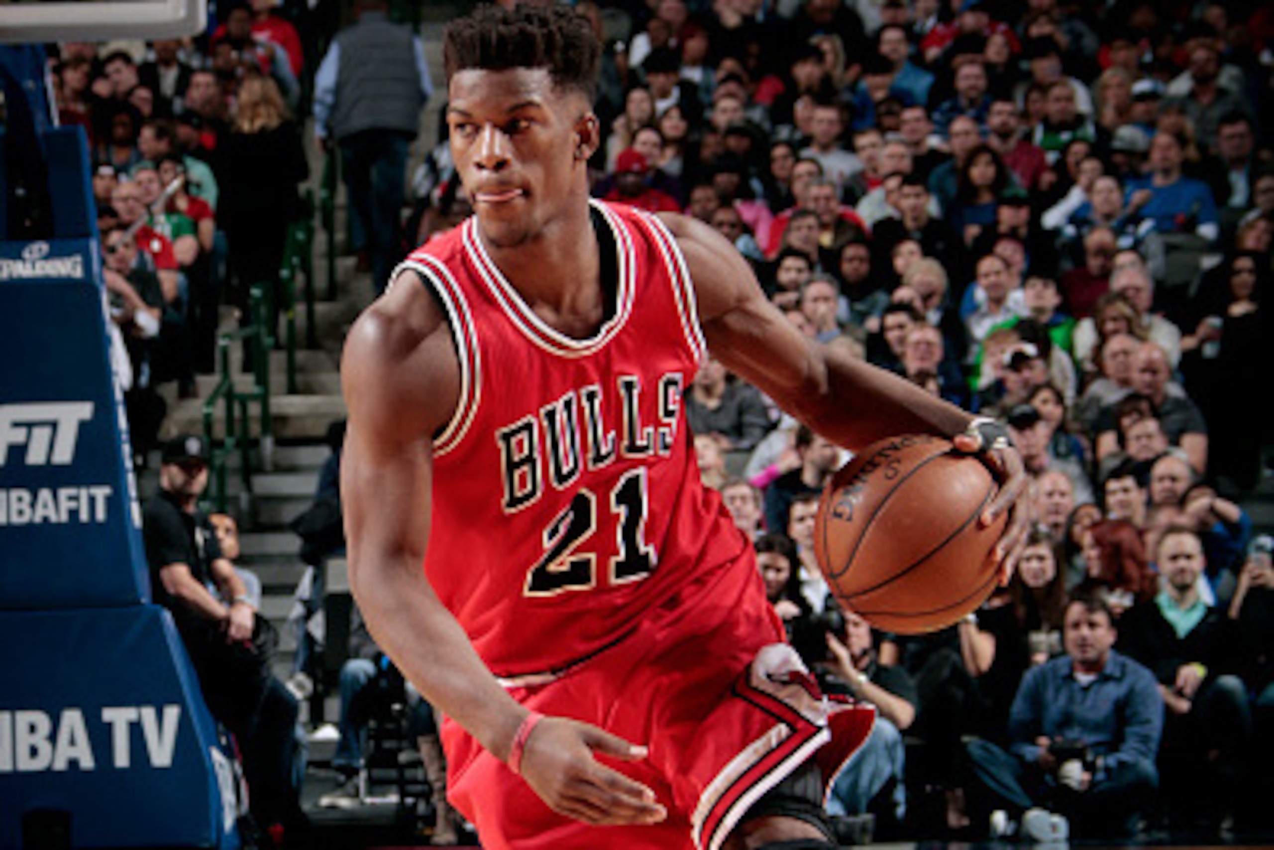 DALLAS, TX - JANUARY 23: Jimmy Butler #21 of the Chicago Bulls handles the ball against the Dallas Mavericks on January 23, 2015 at the American Airlines Center in Dallas, Texas. NOTE TO USER: User expressly acknowledges and agrees that, by downloading an