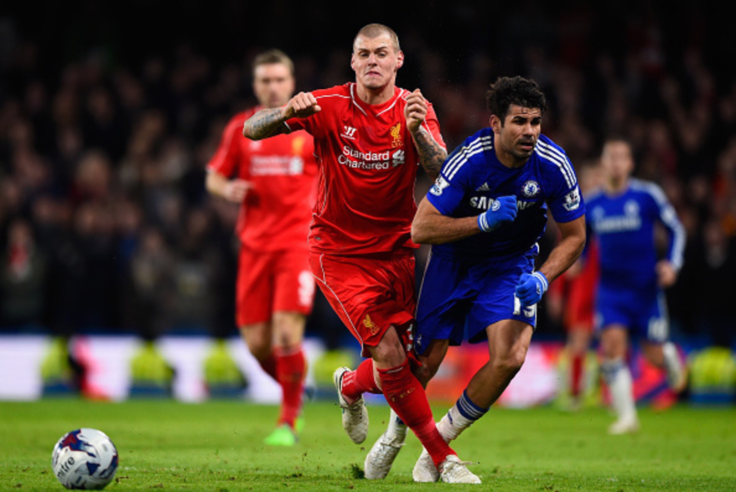 LONDON, ENGLAND - JANUARY 27:  Martin Skrtel of Liverpool brings down Diego Costa of Chelsea  during the Capital One Cup Semi-Final second leg between Chelsea and Liverpool at Stamford Bridge on January 27, 2015 in London, England.  (Photo by Mike Hewitt/