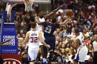Mar 1, 2014; Los Angeles, CA, USA; New Orleans Pelicans forward Anthony Davis (23) goes up for a shot defended by Los Angeles Clippers center DeAndre Jordan (6) during the second quarter at Staples Center. Mandatory Credit: Kelvin Kuo-USA TODAY Sports
