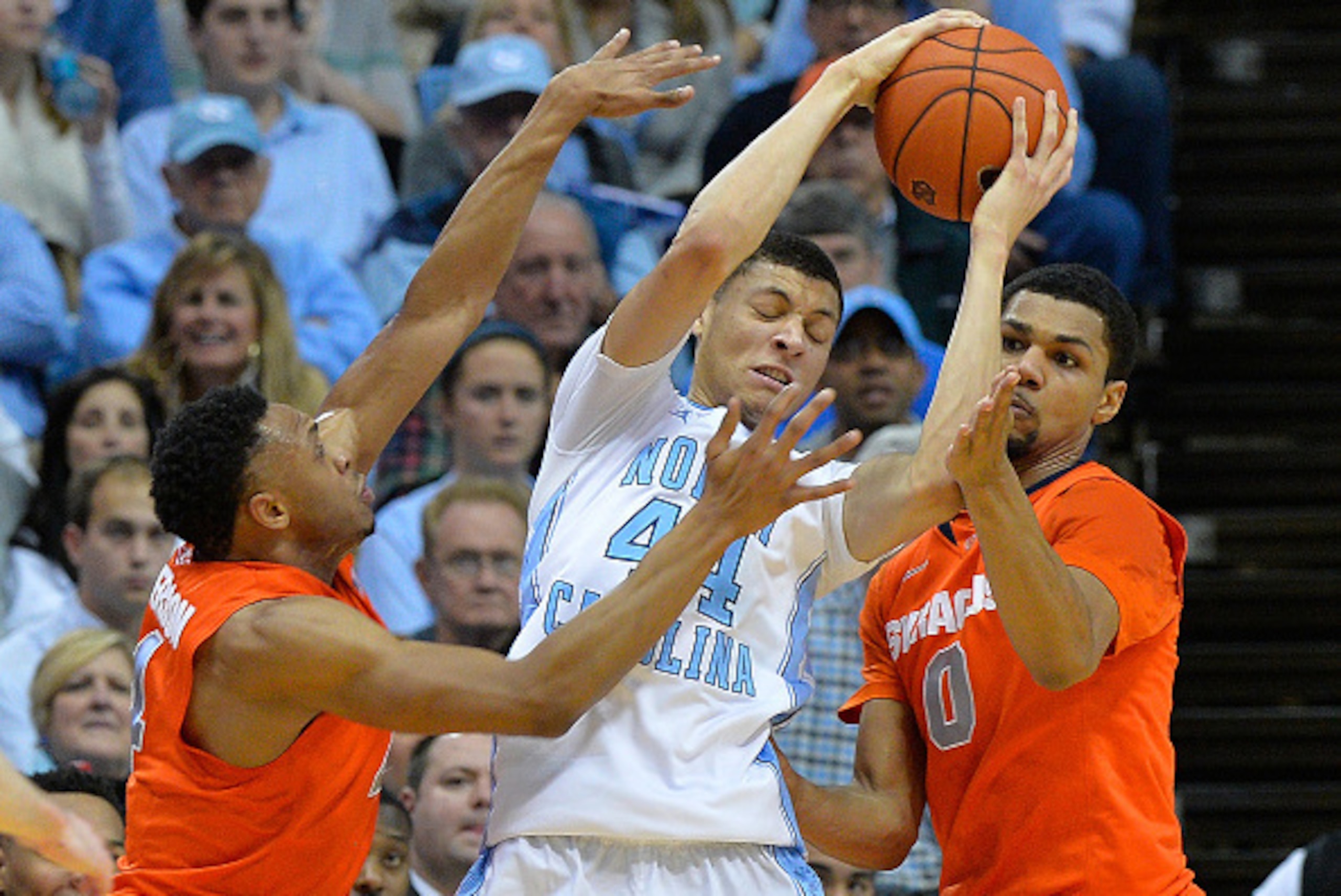 CHAPEL HILL, NC - JANUARY 26:  Ron Patterson #4 and Michael Gbinije #0 of the Syracuse Orange pressure Justin Jackson #44 of the North Carolina Tar Heels during their game at the Dean Smith Center on January 26, 2015 in Chapel Hill, North Carolina.  (Phot