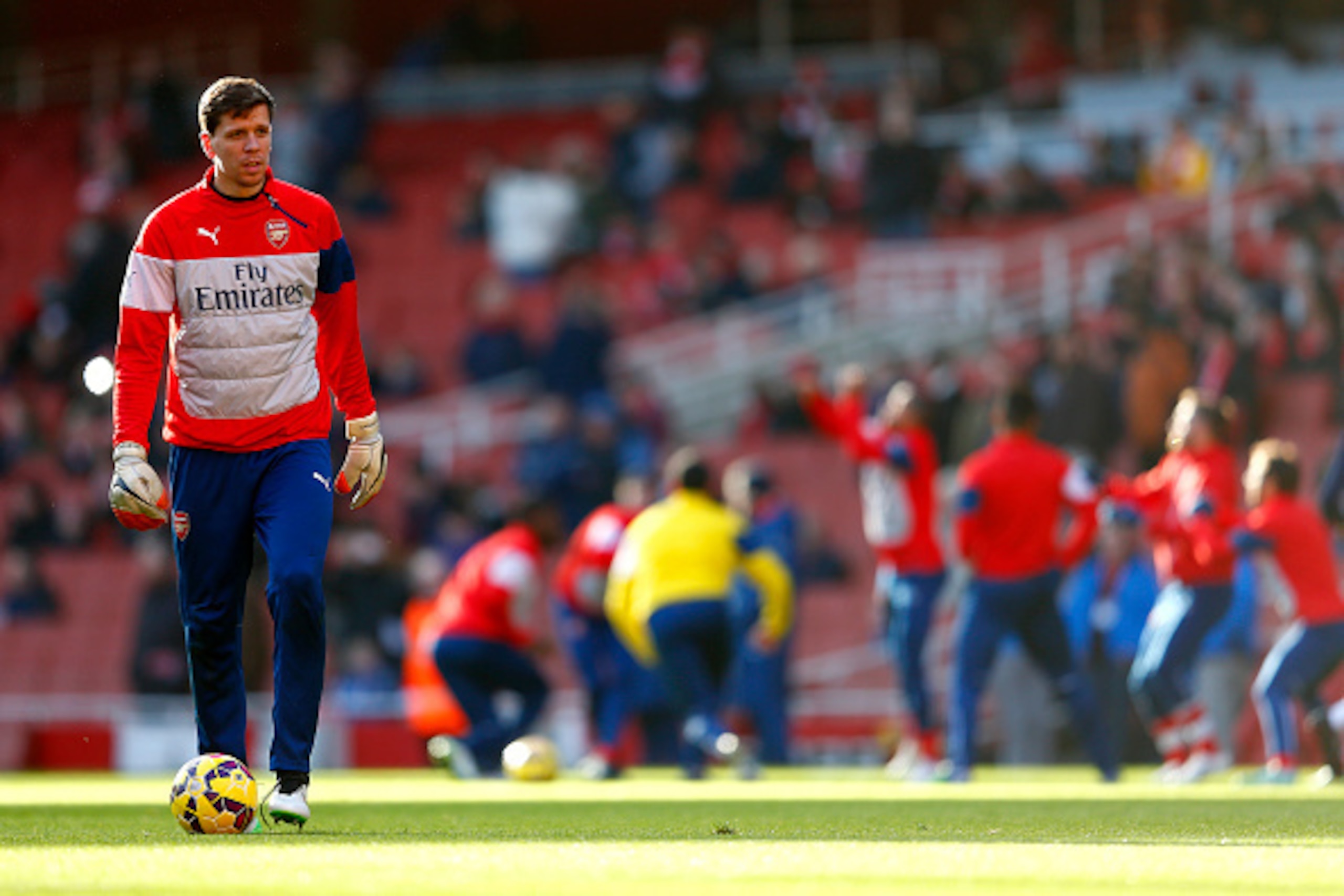 LONDON, ENGLAND - JANUARY 11:  Wojciech Szczesny of Arsenal takes part in the warm-up before the Barclays Premier League match between Arsenal and Stoke City at Emirates Stadium on January 11, 2015 in London, England.  (Photo by Julian Finney/Getty Images