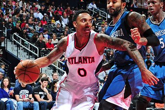 ATLANTA, GA - JANUARY 25: Jeff Teague #0 of the Atlanta Hawks drives against the Minnesota Timberwolves on January 25, 2015 at Philips Arena in Atlanta, Georgia.  NOTE TO USER: User expressly acknowledges and agrees that, by downloading and/or using this 