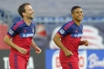 Jul 12, 2014; Foxborough, MA, USA; Chicago Fire forward Mike Magee (9) and forward Quincy Amarikwa (24) react after scoring a goal during the first half against the New England Revolution at Gillette Stadium. Mandatory Credit: Bob DeChiara-USA TODAY Sport