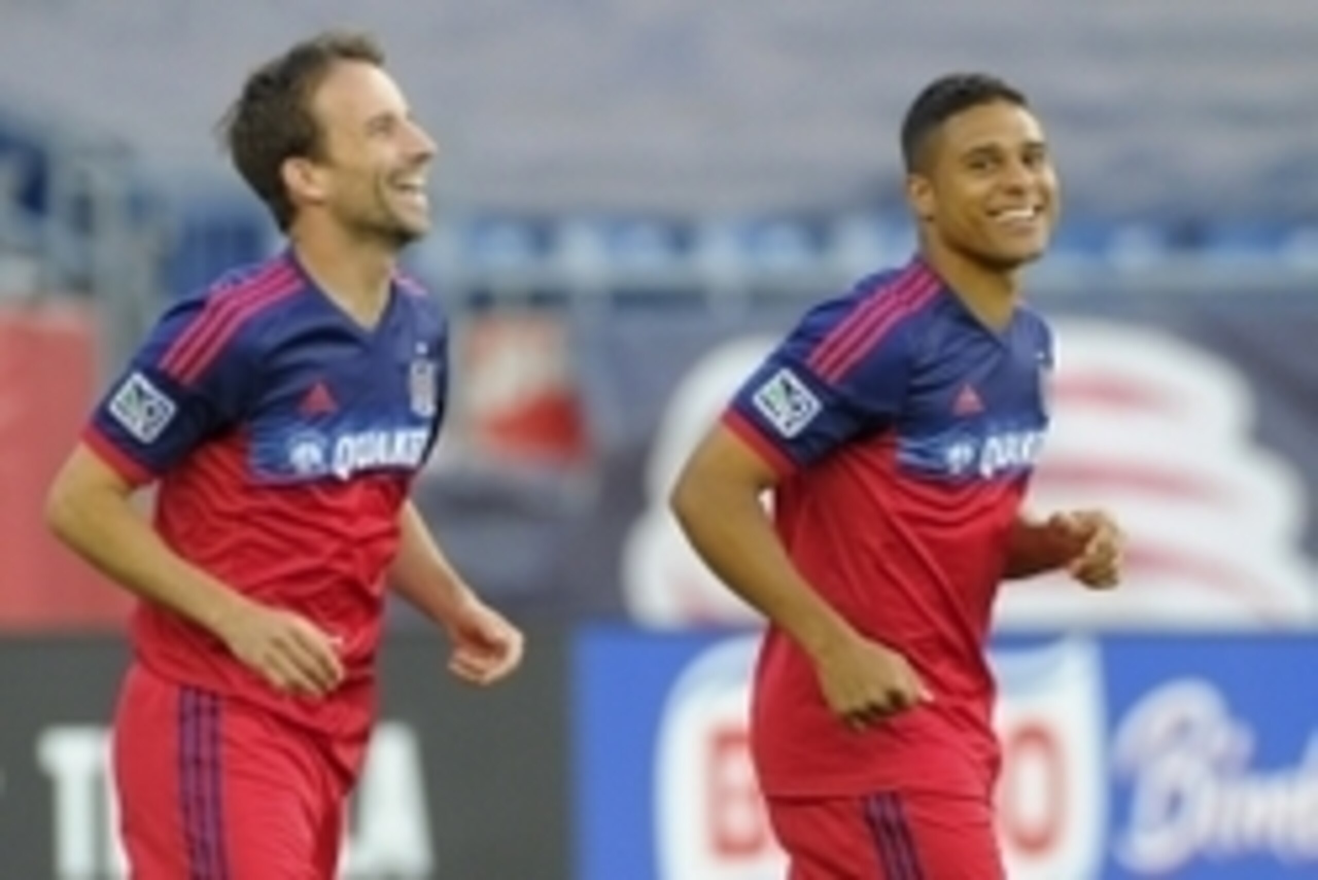 Jul 12, 2014; Foxborough, MA, USA; Chicago Fire forward Mike Magee (9) and forward Quincy Amarikwa (24) react after scoring a goal during the first half against the New England Revolution at Gillette Stadium. Mandatory Credit: Bob DeChiara-USA TODAY Sport