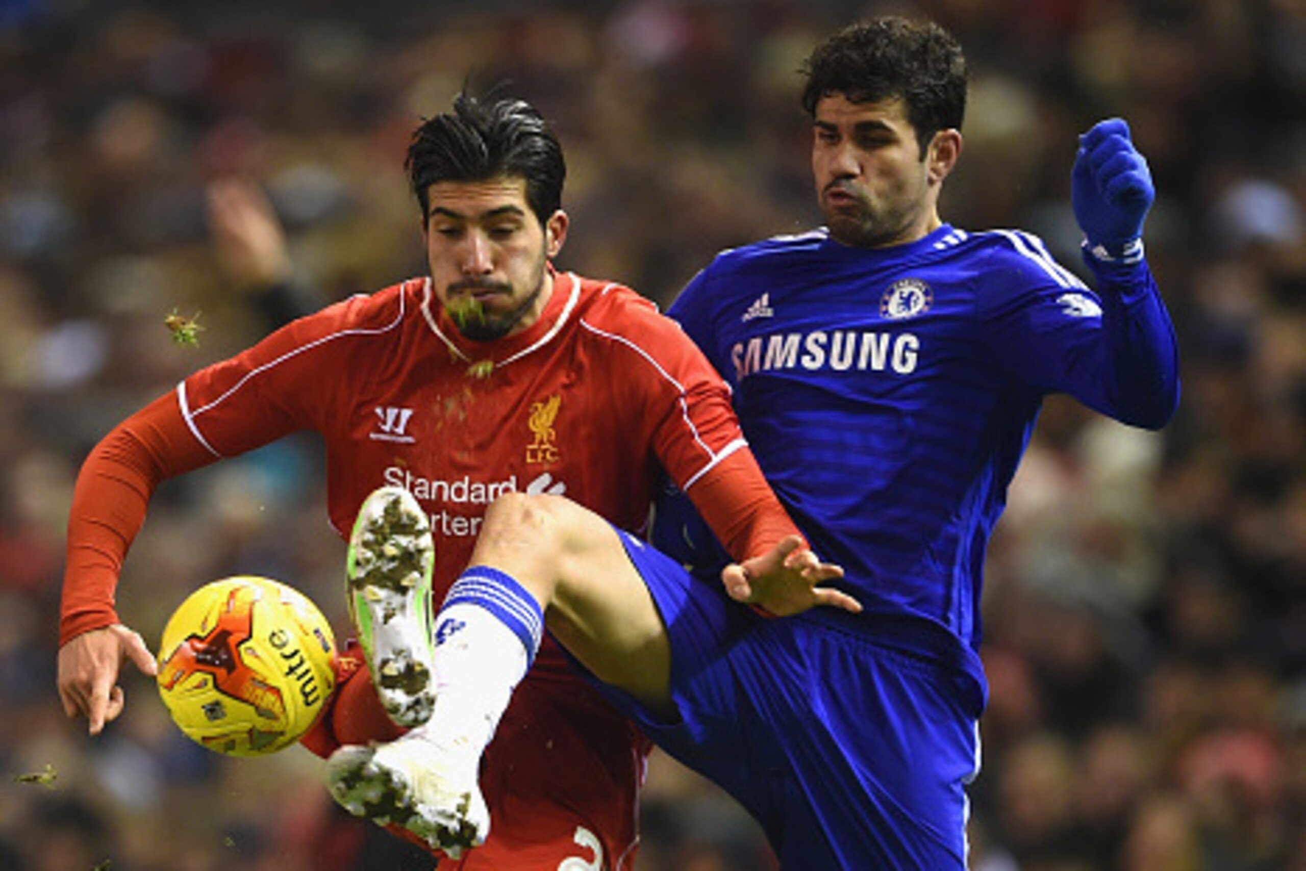 LIVERPOOL, ENGLAND - JANUARY 20:  Emre Can of Liverpool and Diego Costa of Chelsea compete for the ball during the Capital One Cup Semi-Final first leg match between Liverpool and Chelsea at Anfield on January 20, 2015 in Liverpool, England.  (Photo by Mi