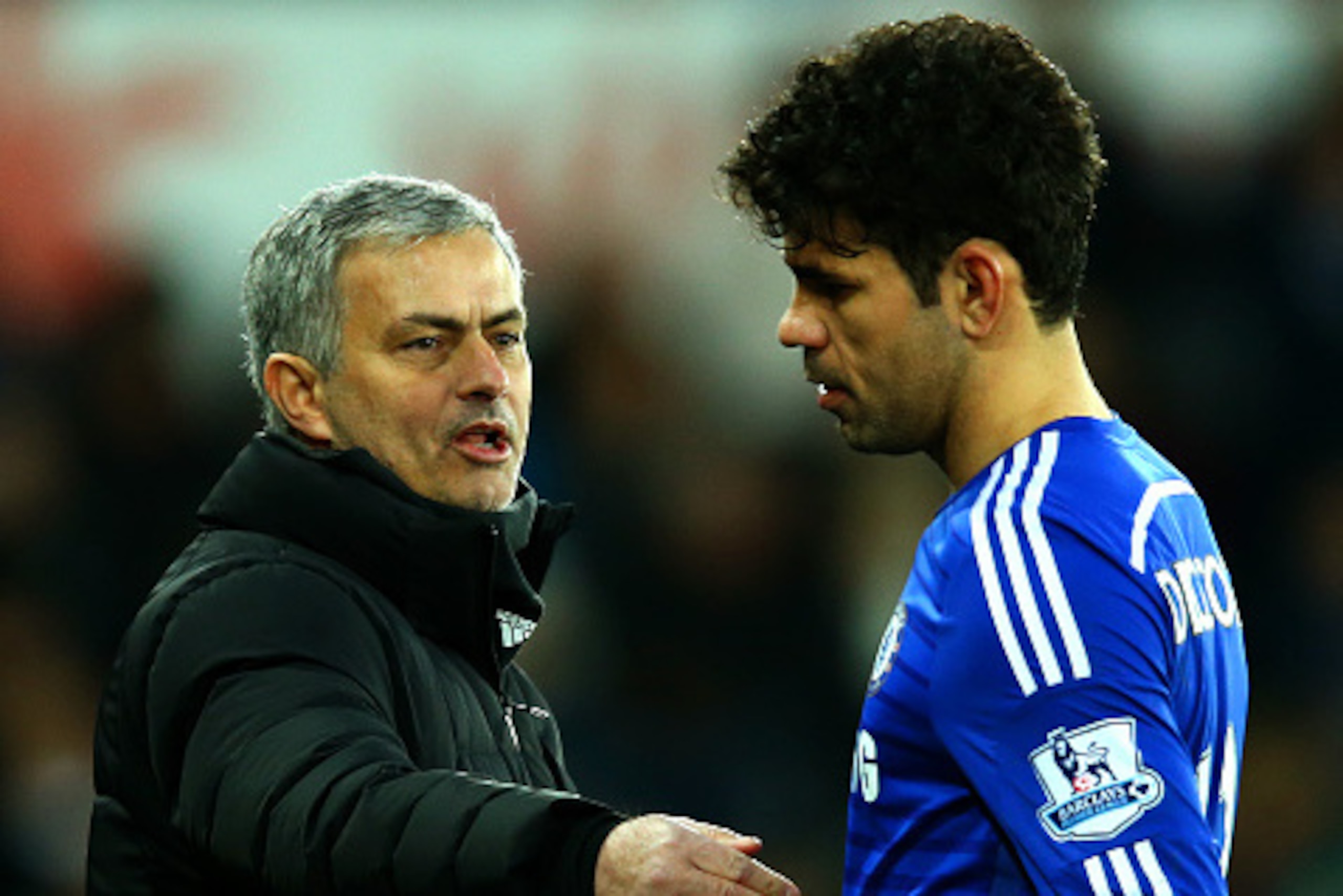 SWANSEA, WALES - JANUARY 17:  Jose Mourinho, manager of Chelsea speaks with Diego Costa as he is substituted during the Barclays Premier League match between Swansea City and Chelsea at Liberty Stadium on January 17, 2015 in Swansea, Wales.  (Photo by Ric