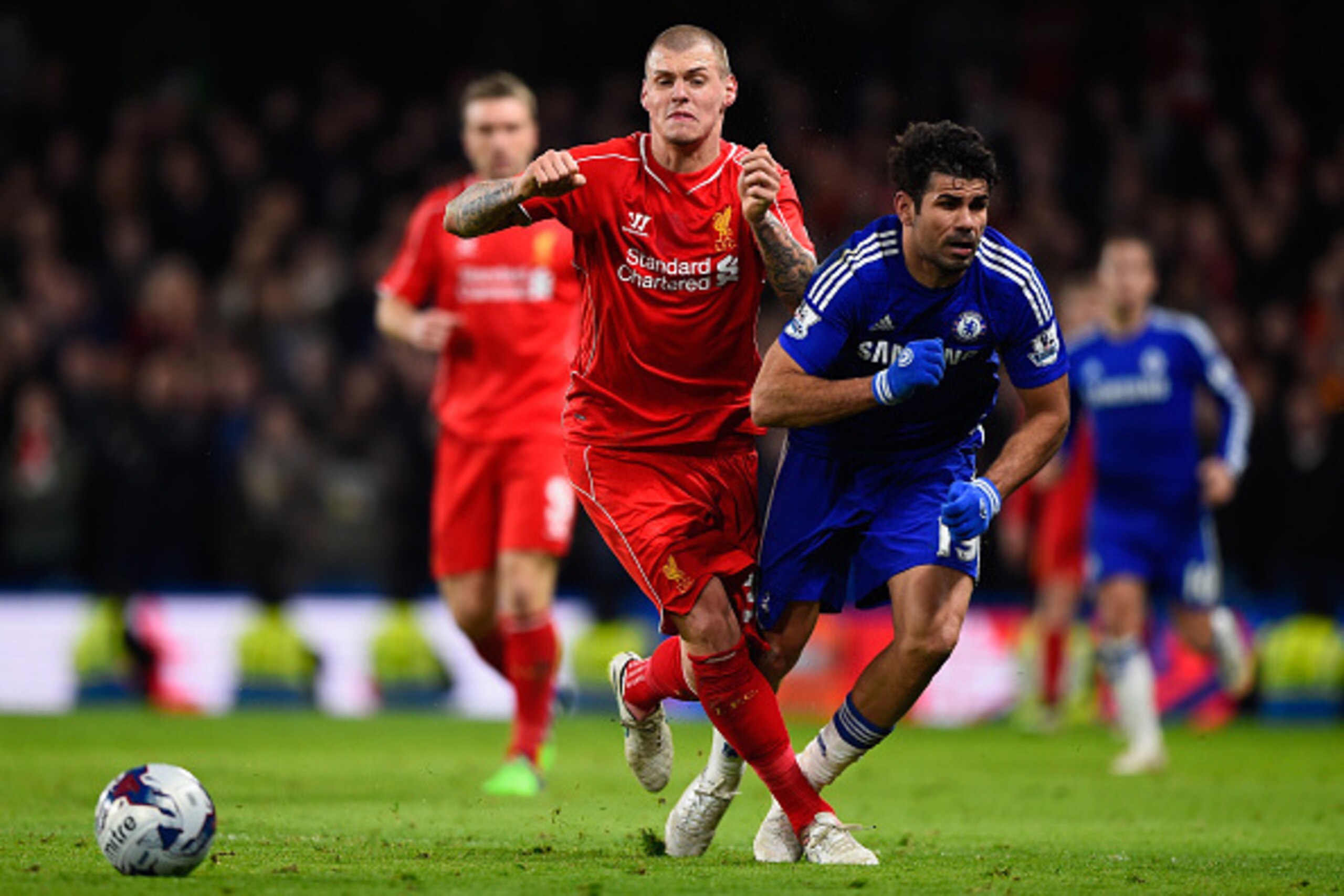 LONDON, ENGLAND - JANUARY 27:  Martin Skrtel of Liverpool brings down Diego Costa of Chelsea  during the Capital One Cup Semi-Final second leg between Chelsea and Liverpool at Stamford Bridge on January 27, 2015 in London, England.  (Photo by Mike Hewitt/