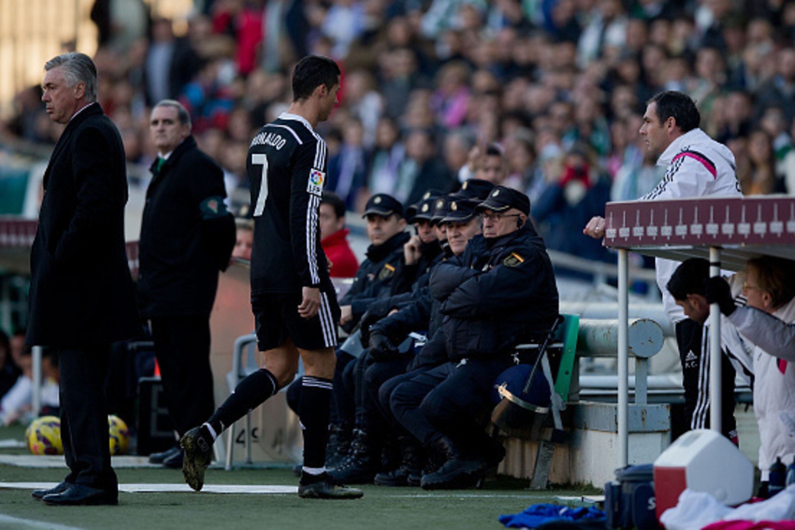 CORDOBA, SPAIN - JANUARY 24: Cristiano Ronaldo (R) of Real Madrid CF leaves the pitch after being reprimanded with a red card as his head coach Carlo Ancelotti (L) looks on during the La Liga match between Cordoba CF and Real Madrid CF at El Arcangel stad