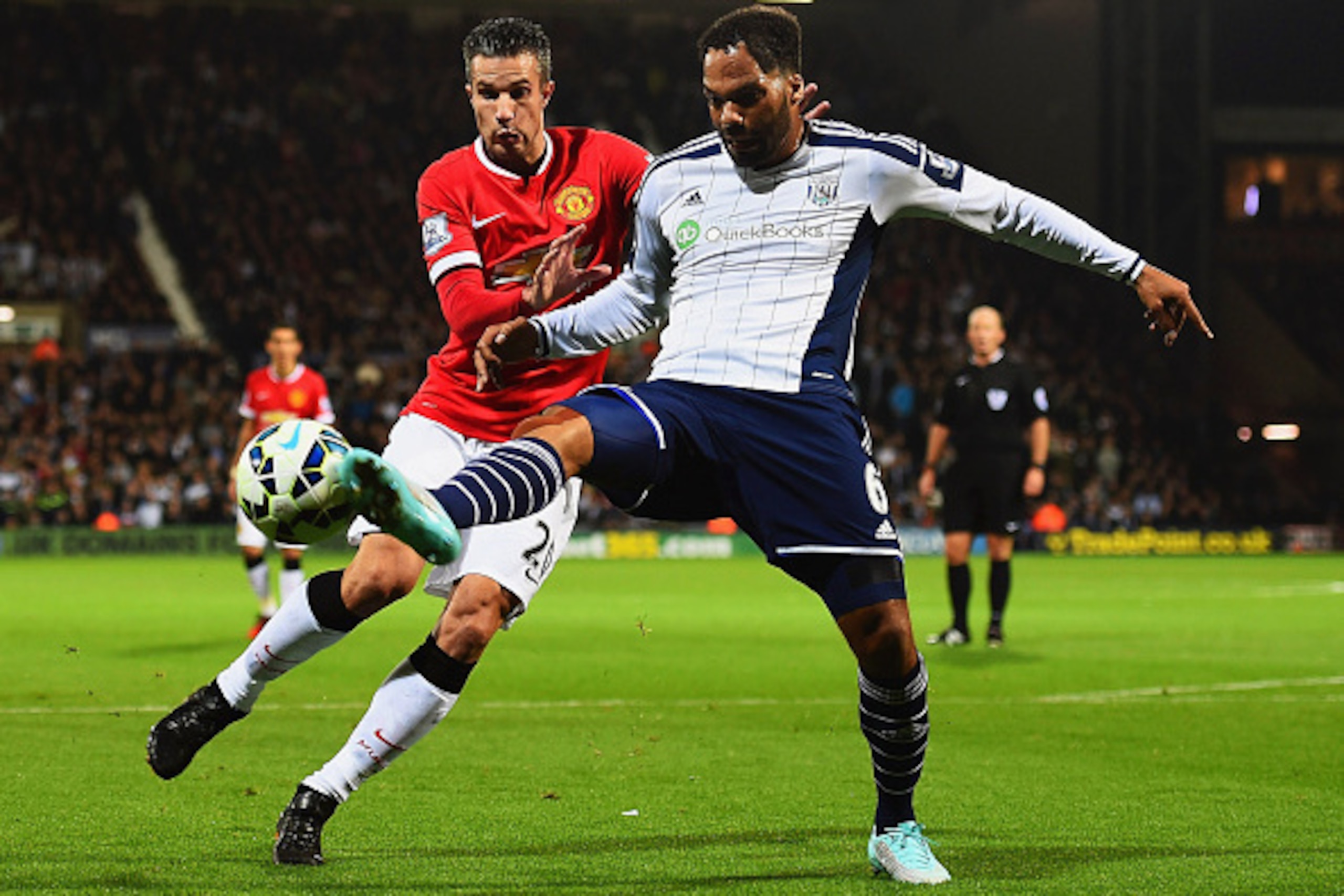 WEST BROMWICH, ENGLAND - OCTOBER 20:  Joleon Lescott of West Bromwich Albion clears the ball from Robin van Persie of Manchester United during the Barclays Premier League match between West Bromwich Albion and Manchester United at The Hawthorns on October