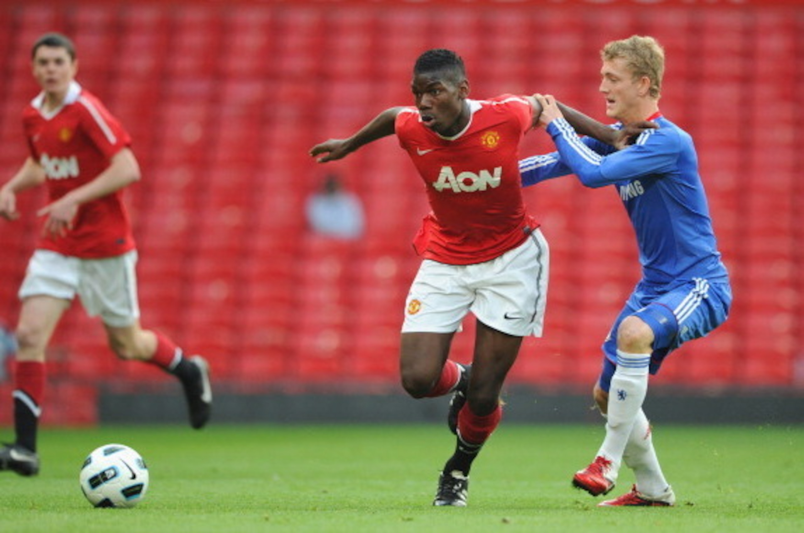 MANCHESTER, ENGLAND - APRIL 20:  Bobby Devyne of Chelsea battles Paul Pogba of Manchester United during the FA Youth Cup Semi Final 2nd Leg between Manchester United and Chelsea at Old Trafford on April 20, 2011 in Manchester, England.  (Photo by Michael 