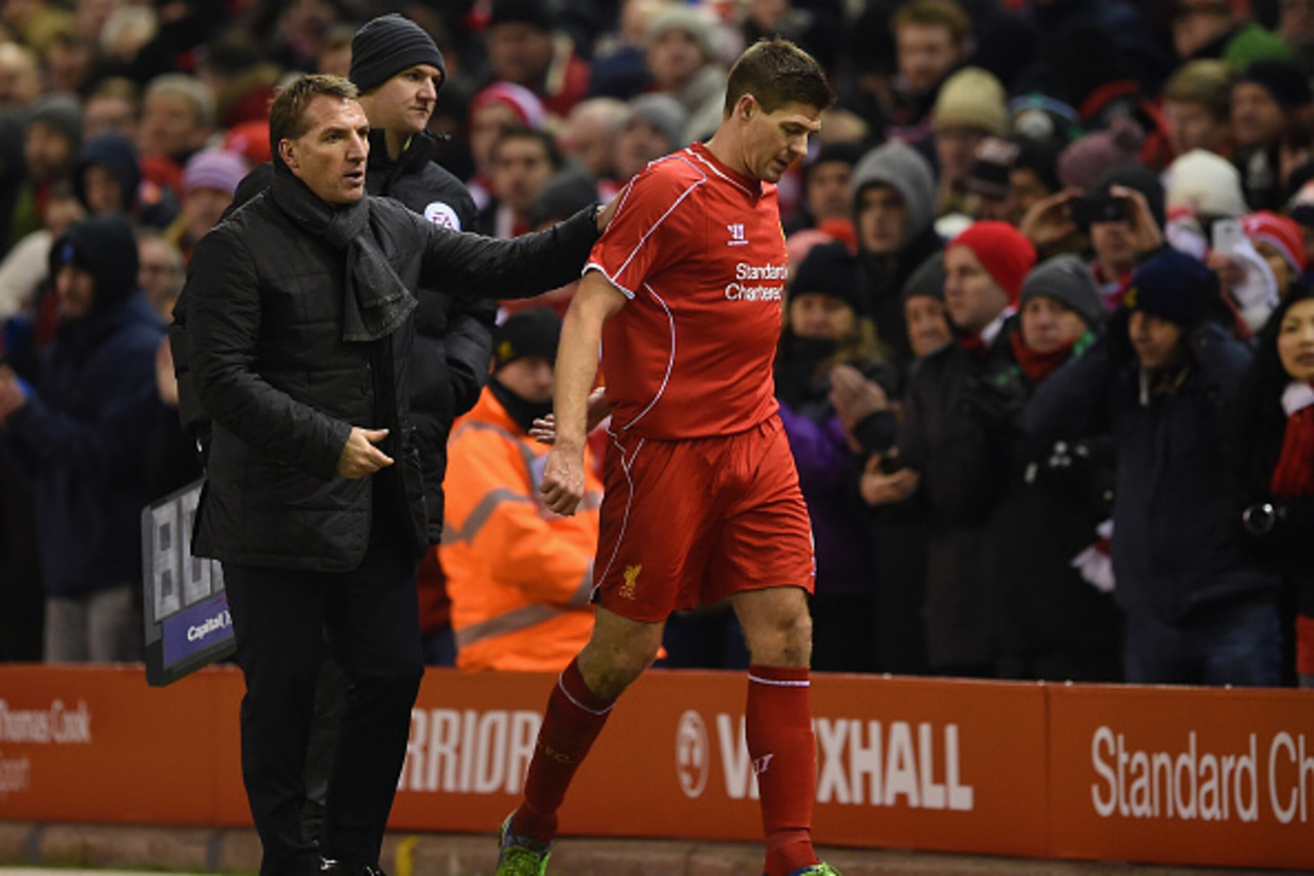 LIVERPOOL, ENGLAND - JANUARY 20:  Brendan Rodgers, manager of Liverpool pats Steven Gerrard of Liverpool on the back as he is subsituted during the Capital One Cup Semi-Final first leg match between Liverpool and Chelsea at Anfield on January 20, 2015 in 