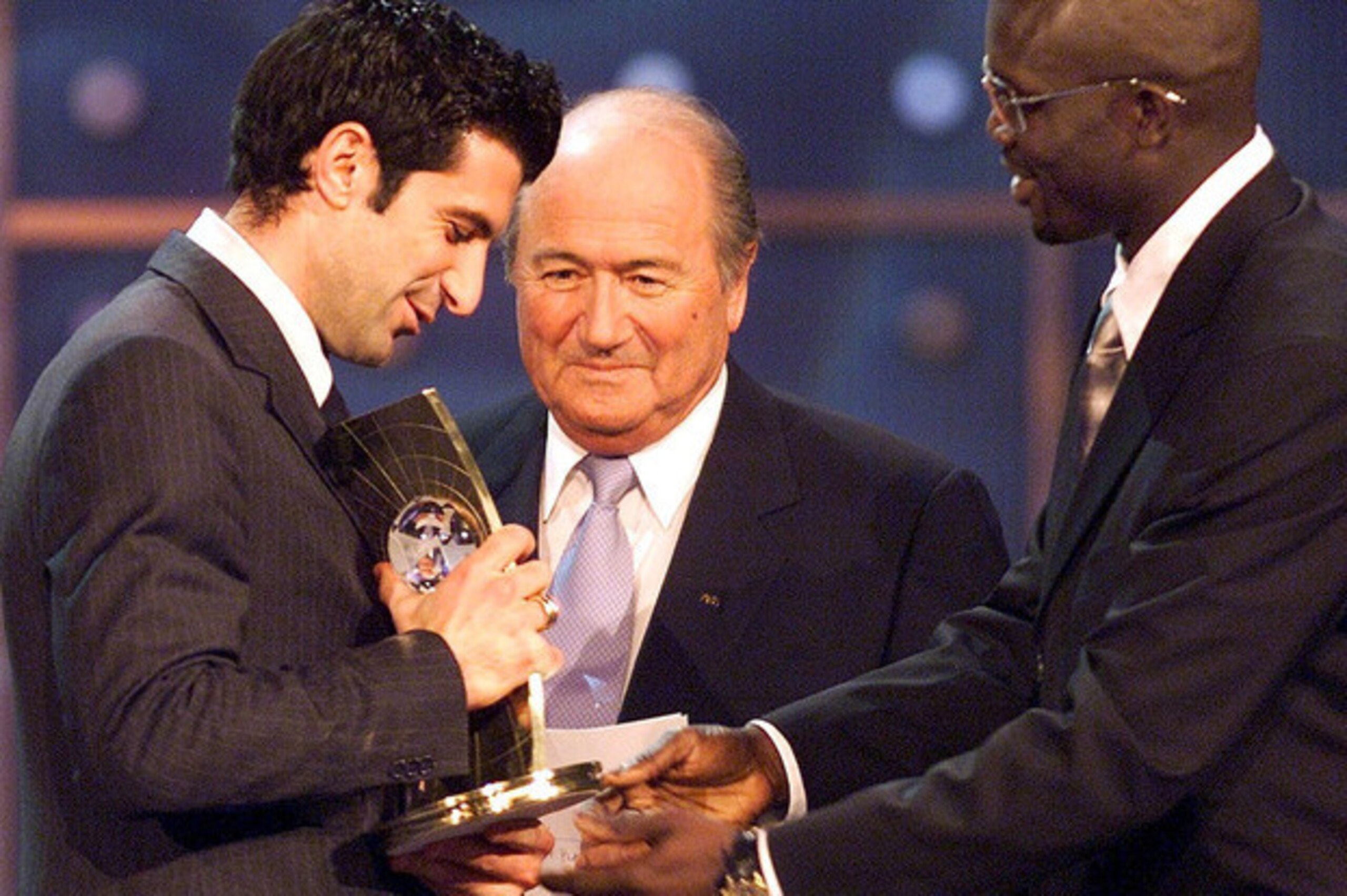 Figo receiving the FIFA World Player of the Year award, with Blatter in attendance, in 2001