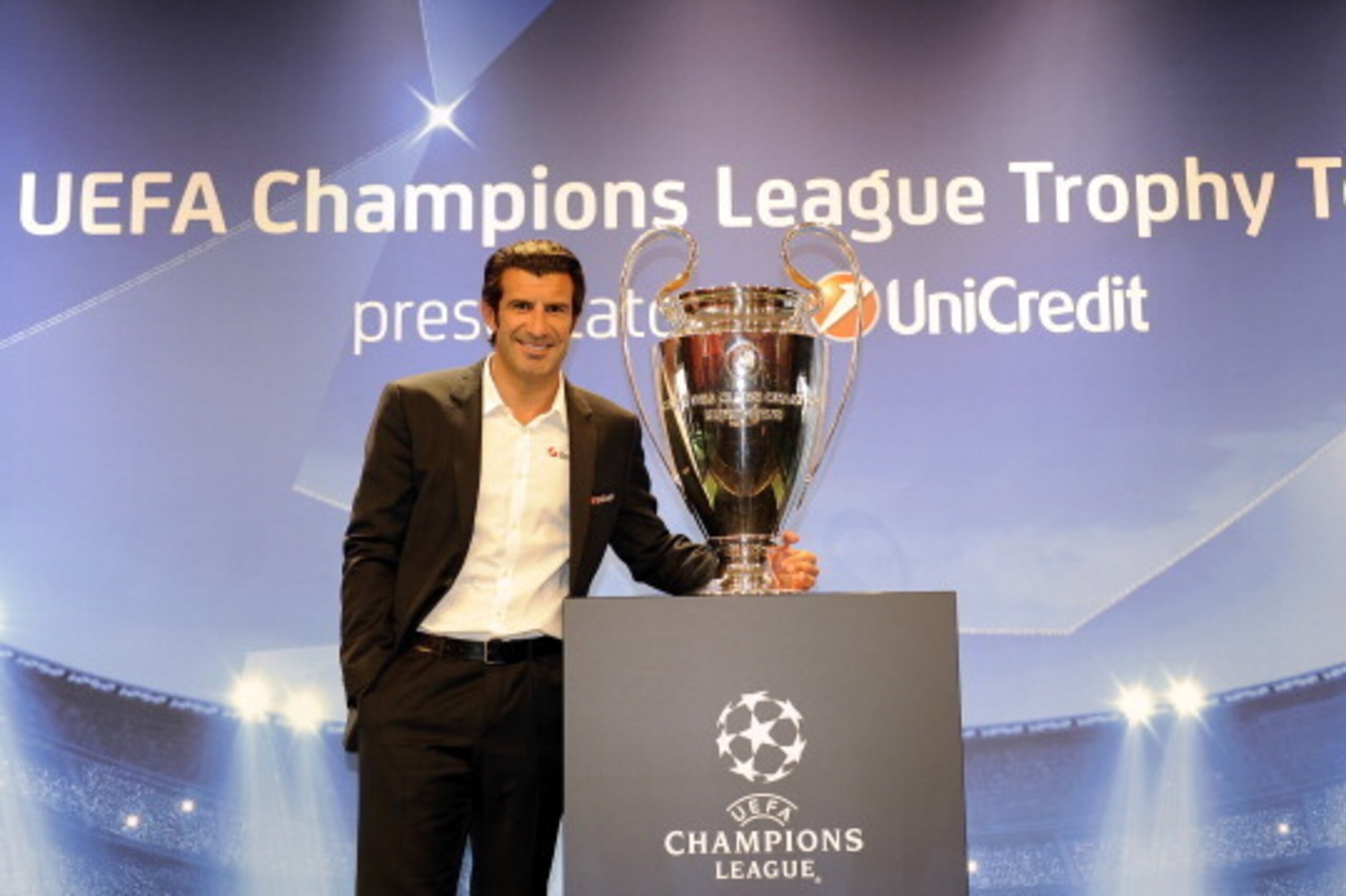 MILAN, ITALY - SEPTEMBER 13:  Luis Figo poses with the UEFA Champions League trophy during the UEFA Champions League Trophy Tour 2012/13 on September 13, 2012 in Milan, Italy.  (Photo by Claudio Villa/Getty Images for UEFA)