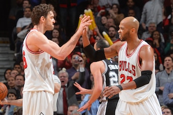 CHICAGO,IL - JANUARY 22: Taj Gibson #22 and Pau Gasol #16 of the Chicago Bulls shake hands after a great play against the San Antonio Spurs at the United Center on January 21, 2015 in Chicago, Illinois . NOTE TO USER: User expressly acknowledges and agree
