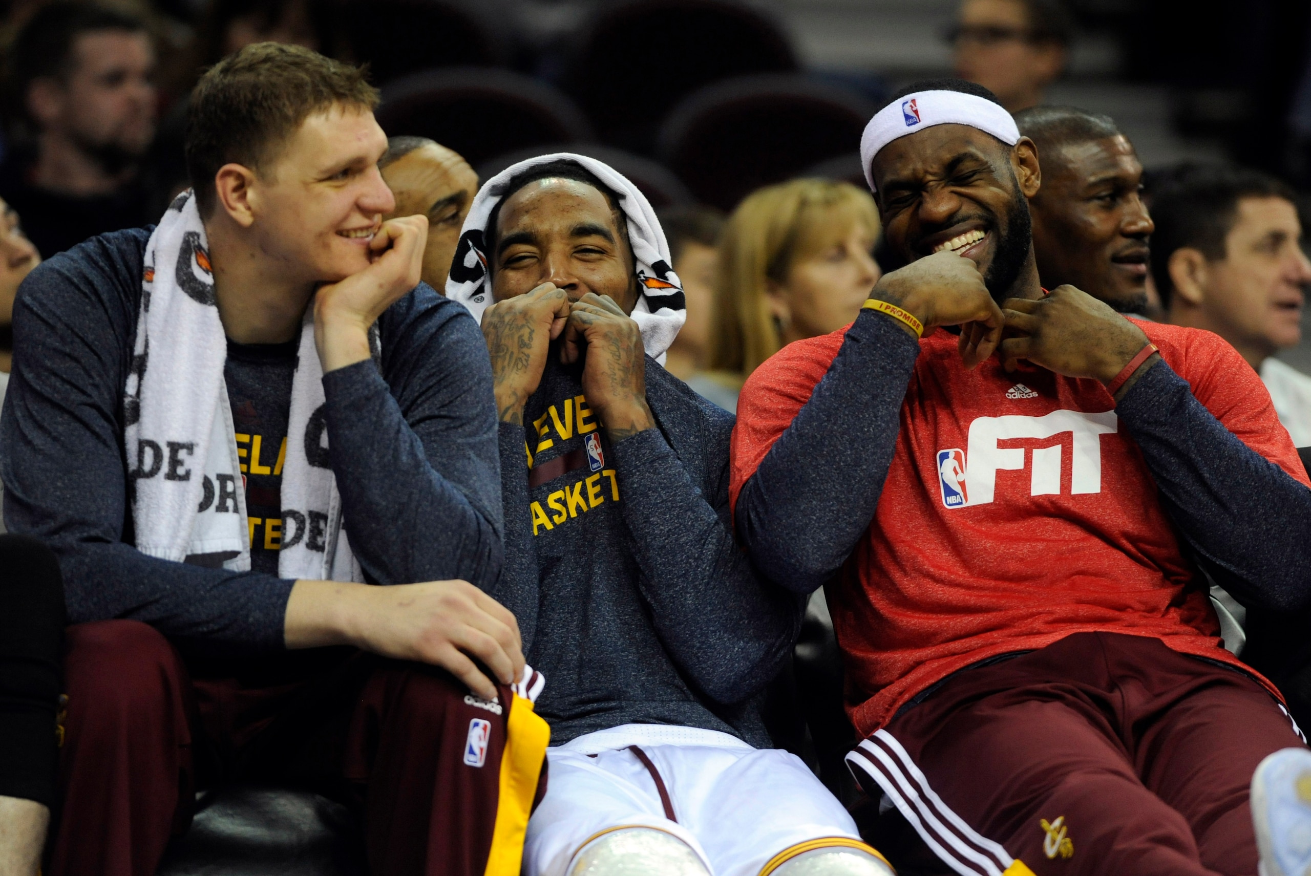 Jan 23, 2015; Cleveland, OH, USA; Cleveland Cavaliers center Timofey Mozgov (20), Cleveland Cavaliers guard J.R. Smith (5) and Cleveland Cavaliers forward LeBron James (23) laugh on the bench during the fourth quarter against the Charlotte Hornets at Quic