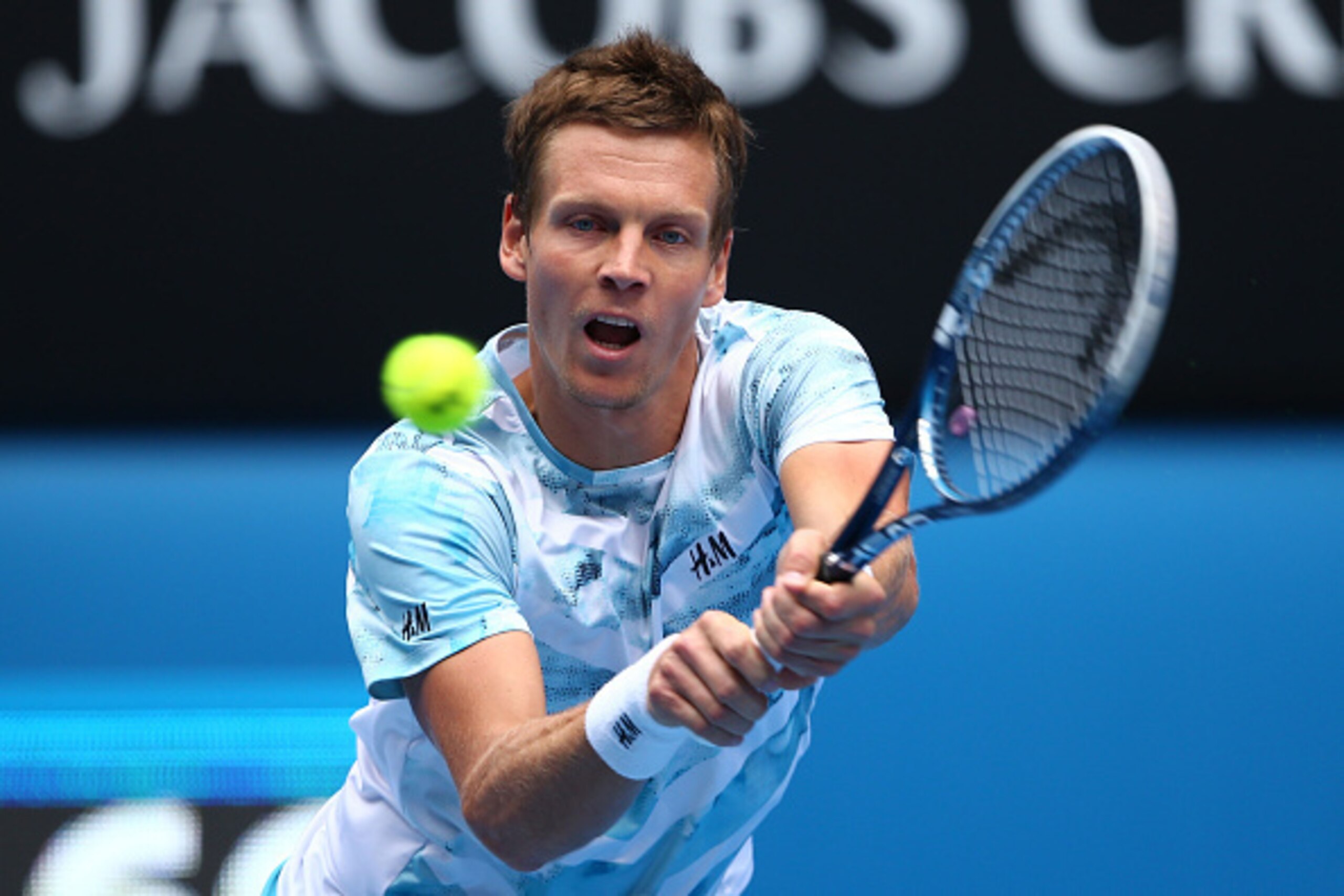 MELBOURNE, AUSTRALIA - JANUARY 27:  Tomas Berdych of the Czech Republic plays a backhand in his quarterfinal match against Rafael Nadal of Spain during day nine of the 2015 Australian Open at Melbourne Park on January 27, 2015 in Melbourne, Australia.  (P