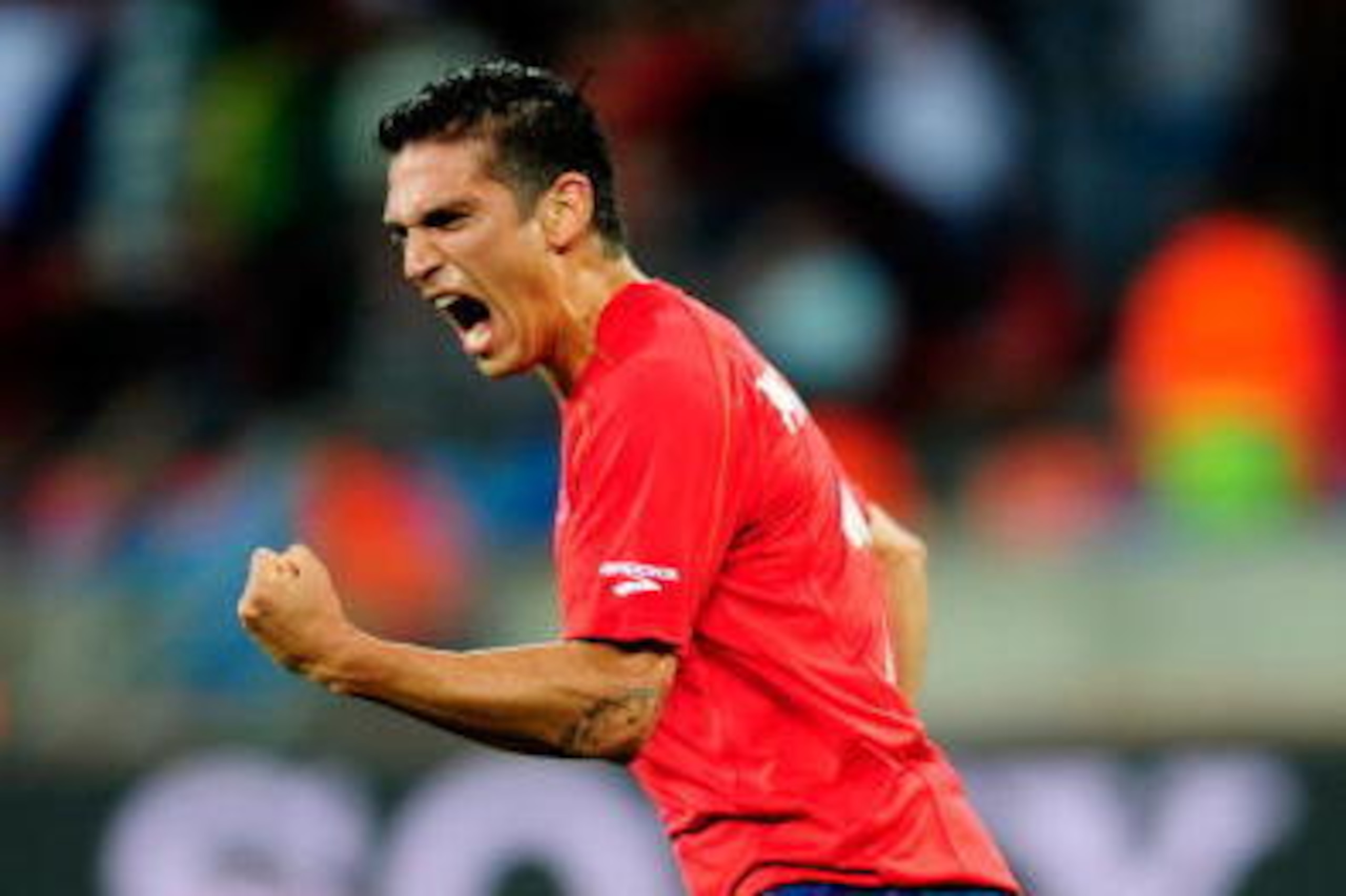 PORT ELIZABETH, SOUTH AFRICA - JUNE 21:  Mark Gonzalez of Chile celebrates scoring the opening goal during the 2010 FIFA World Cup South Africa Group H match between Chile and Switzerland at Nelson Mandela Bay Stadium on June 21, 2010 in Port Elizabeth, S
