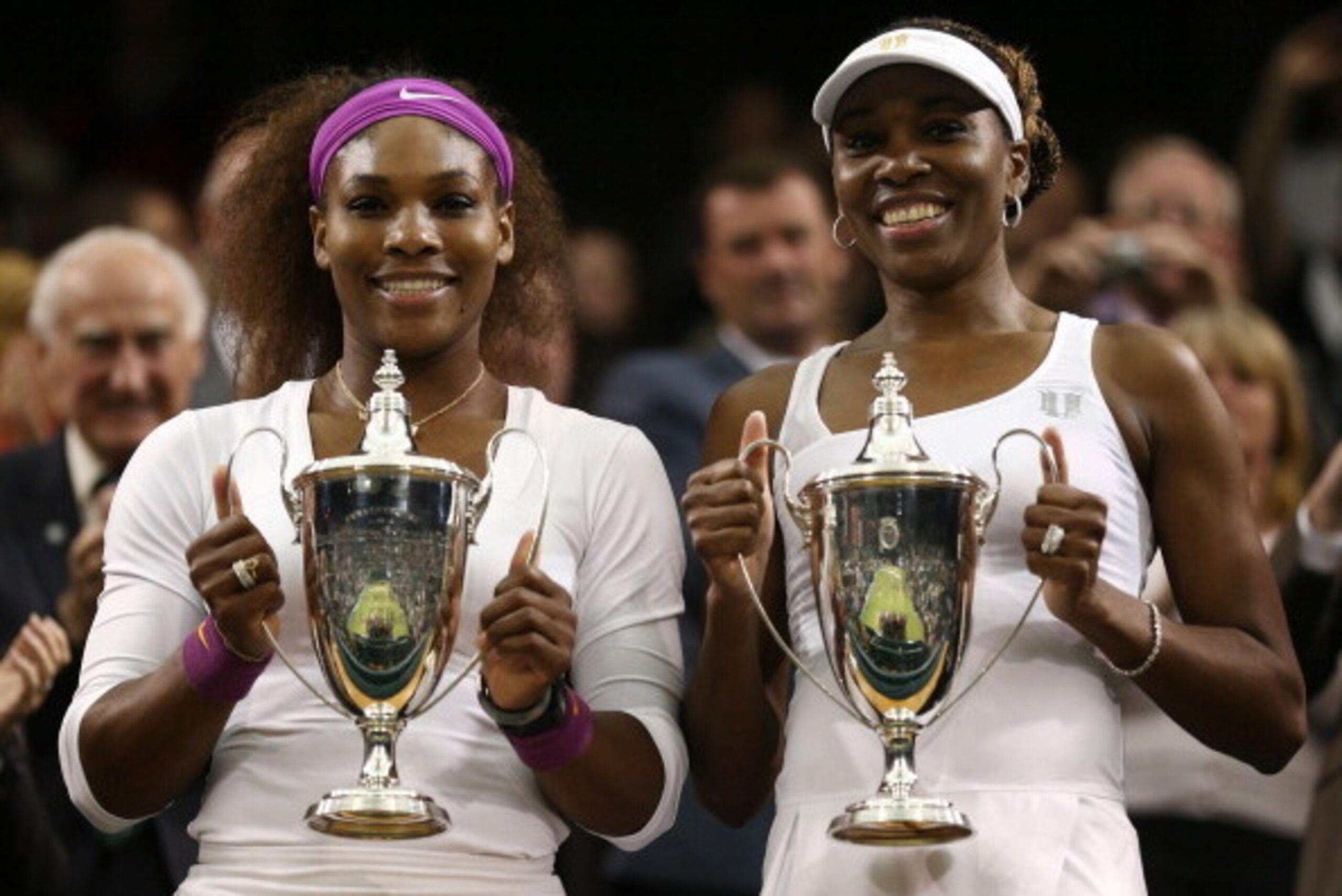 LONDON, ENGLAND - JULY 07:  Serena Williams (L) and Venus Williams of the USA pose with their winners trophies after winning their Ladies’ Doubles final match against Andrea Hlavackova and Lucie Hradecka of the Czech Republic on day twelve of the Wimbledo